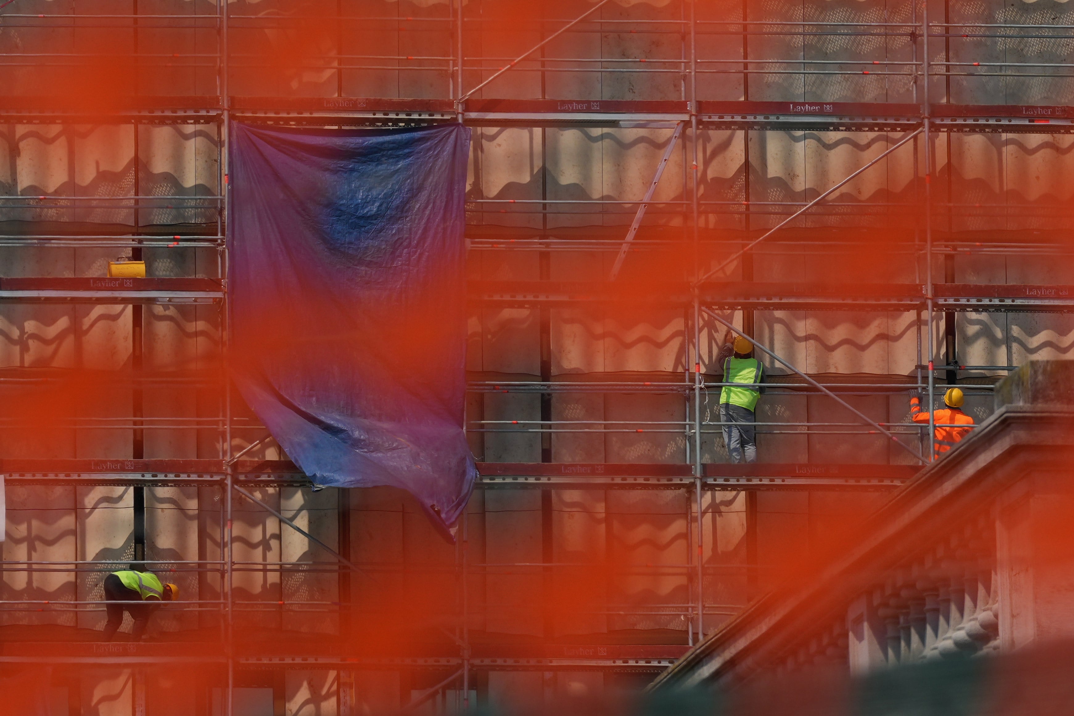Workers on scaffolding. Photo: AP