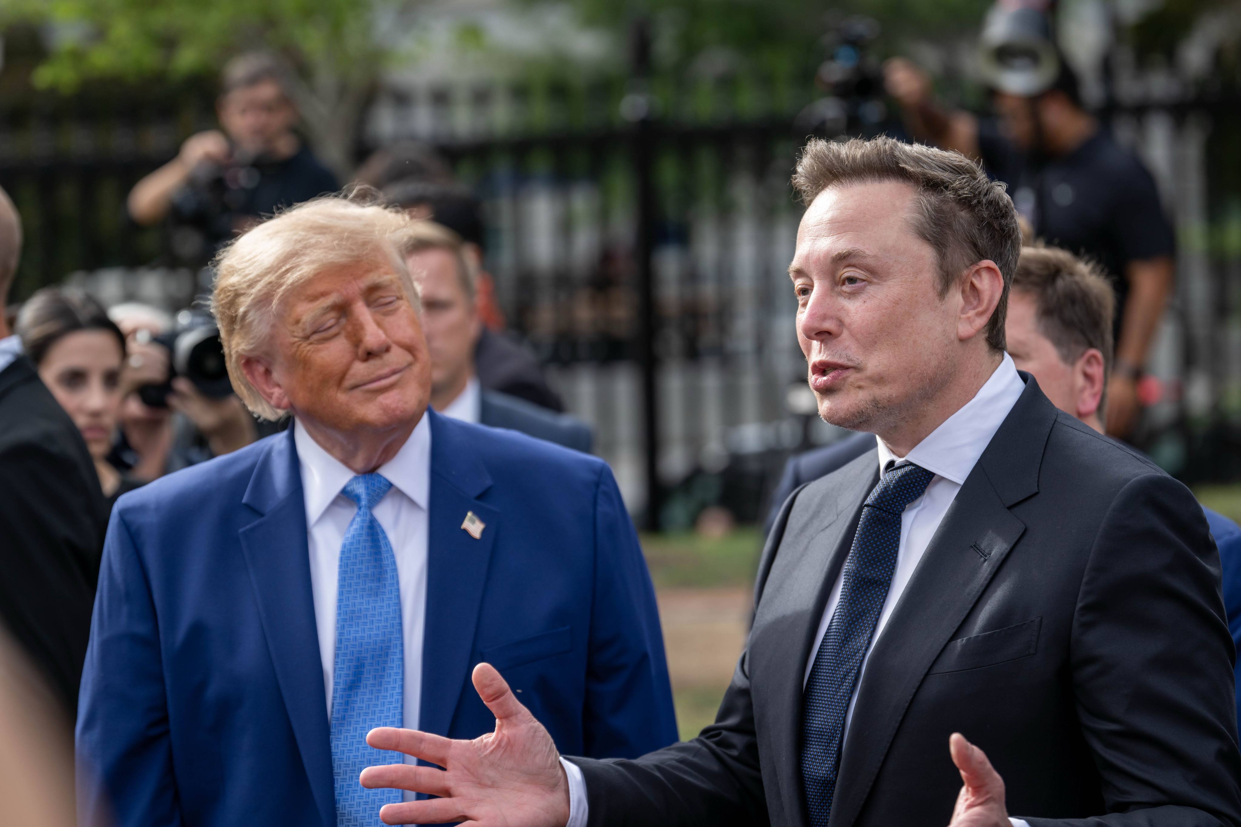 US President Donald Trump listens as Tesla and SpaceX CEO Elon Musk speaks during a meeting of technology executives at the White House in September. Photo: dpa