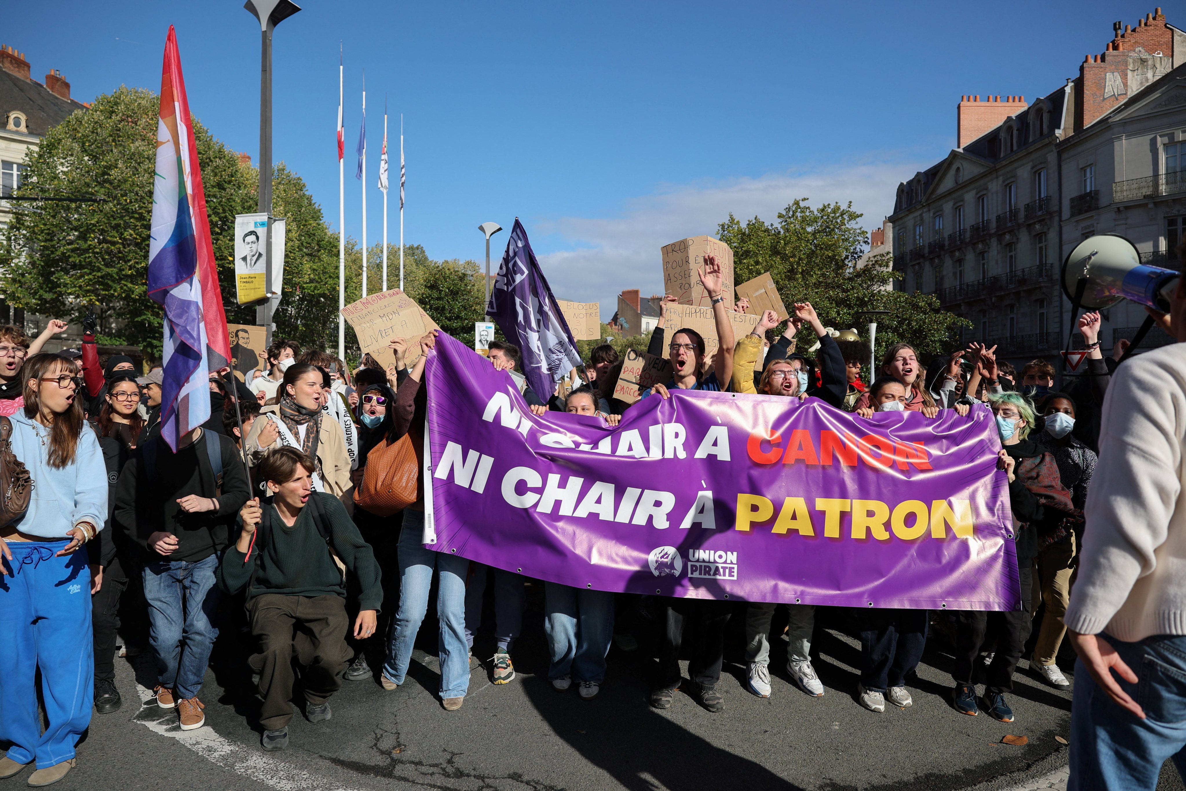 Protesters hold a Union Pirate banner that reads “Neither cannon fodder, nor boss fodder”, as French high school and university students attend a demonstration in Nantes on Thursday. Photo: Reuters