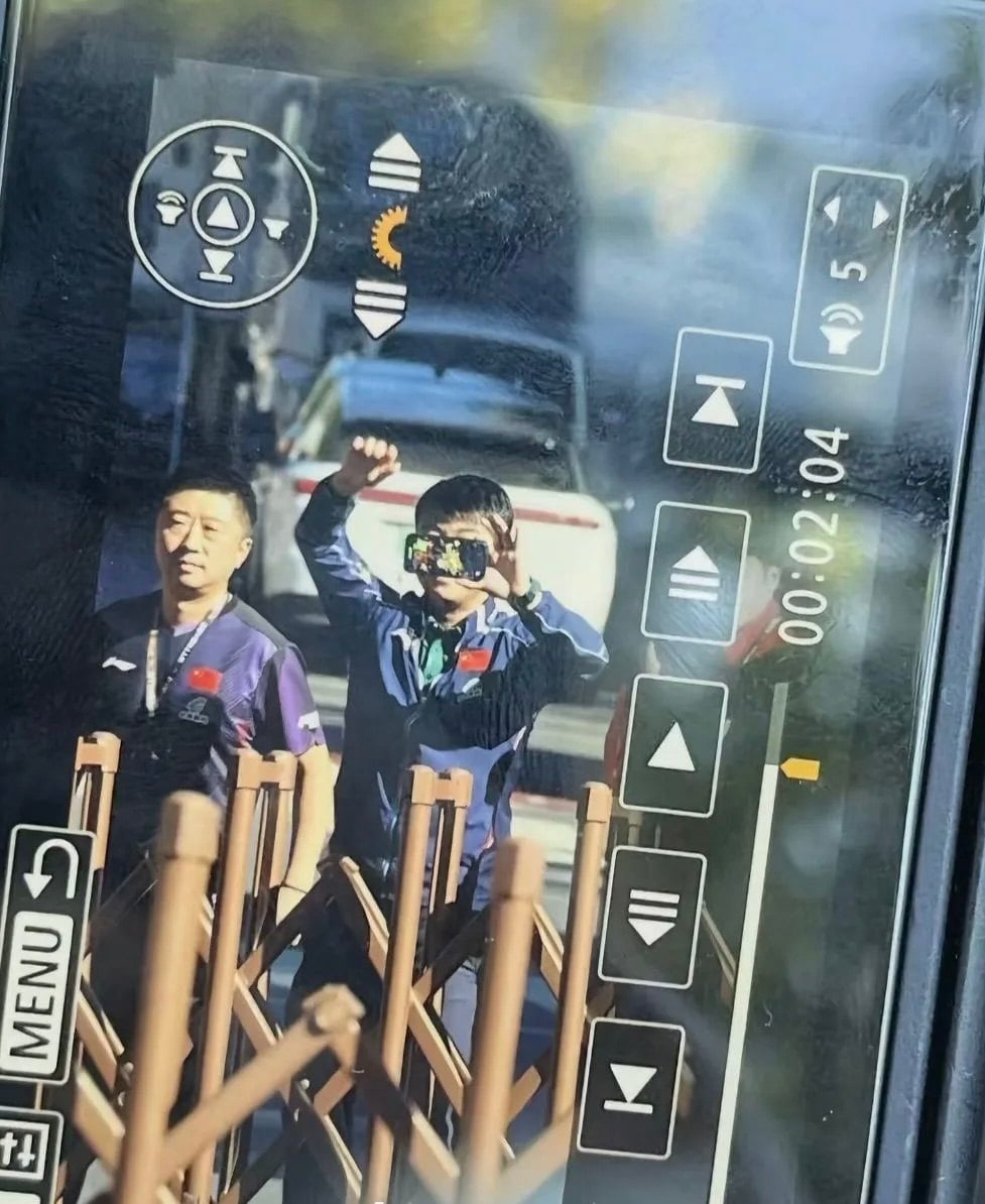 China men’s head coach Wang Hao using his phone to record evidence of the crowd incident before reporting the incident to police officers. Photo: Douyin