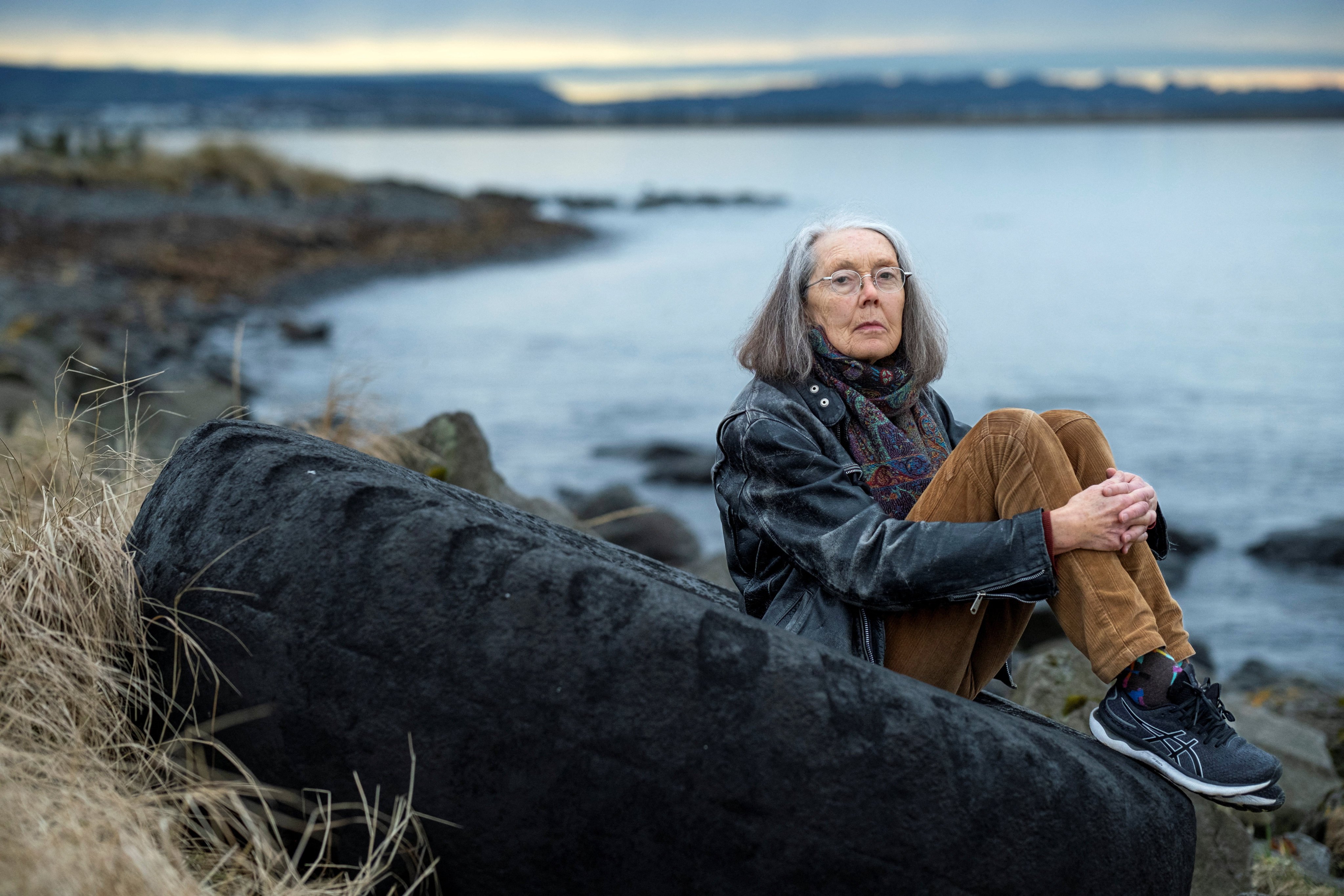 Anne Carson, winner of the Nobel Prize for Literature in 2026, sits outside her home at Aegissioa in Reykjavik, Iceland, in October 2023. Photo: Reuters