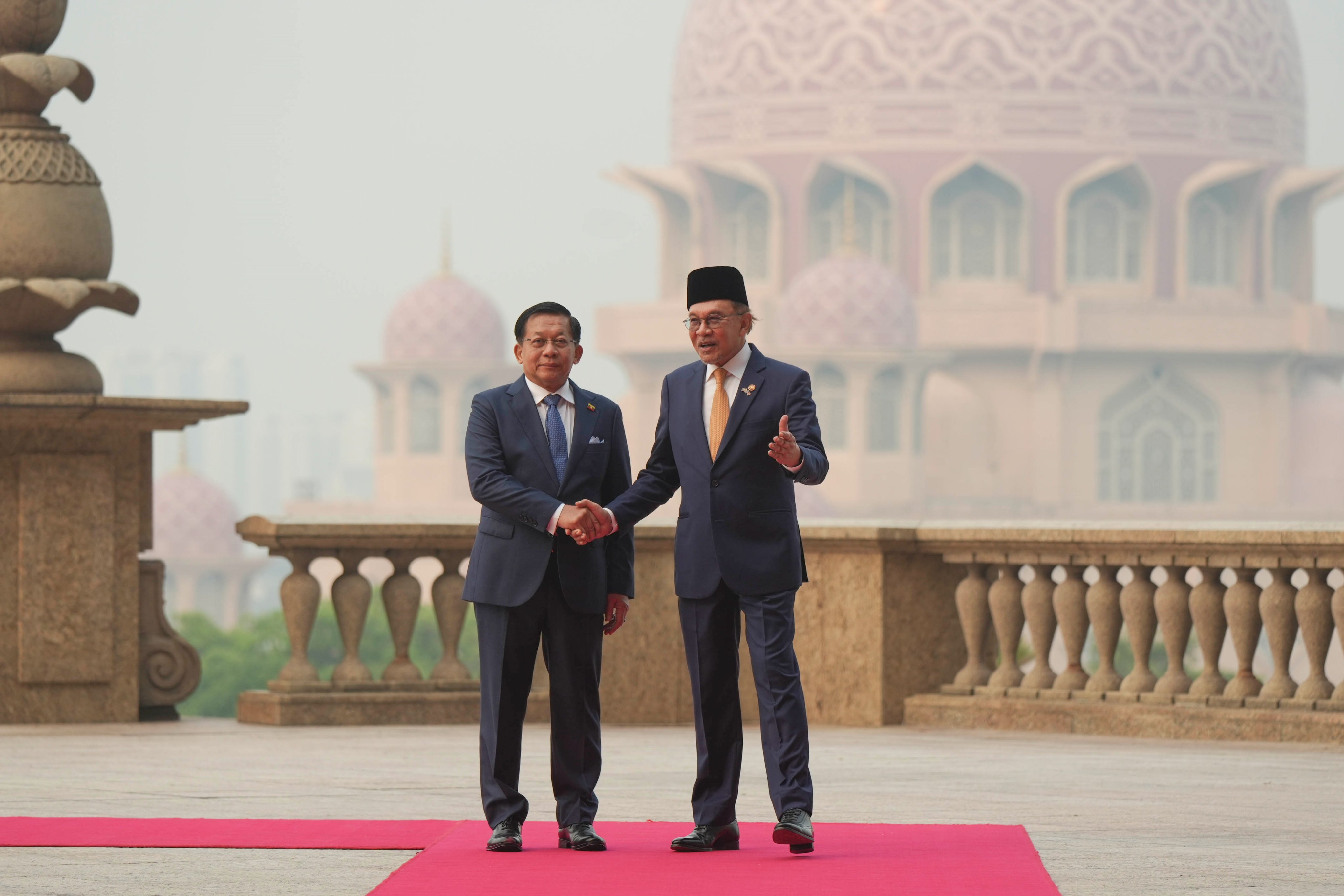 Myanmar’s President Min Aung Hlaing (left) shakes hands with Malaysia’s Prime Minister Anwar Ibrahim in Putrajaya on Thursday. Photo: EPA
