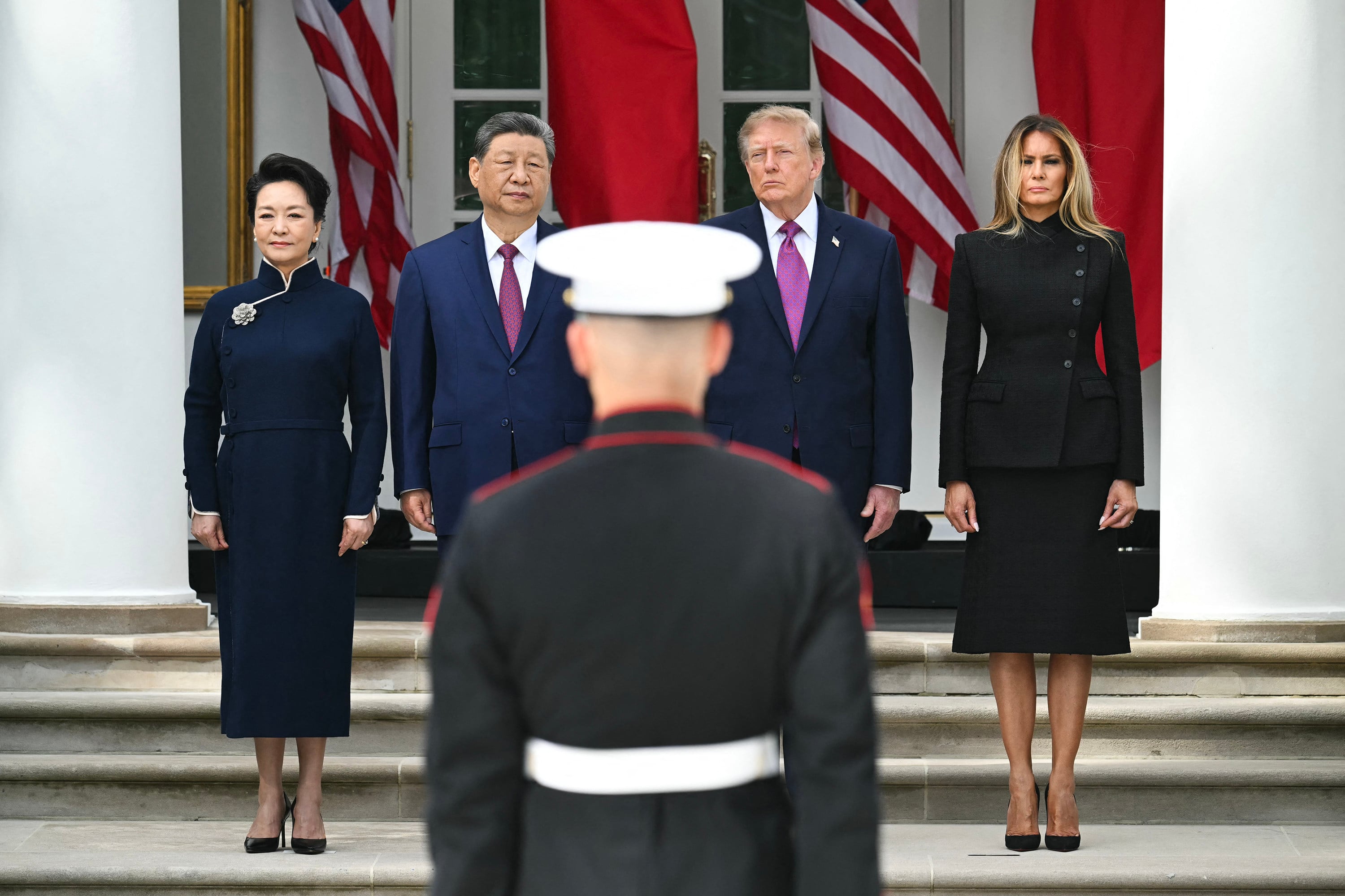 China’s first lady, Peng Liyuan, Chinese President Xi Jinping, US President Donald Trump and US first lady Melania Trump look on during a military review in the Rose Garden of the White House on September 24. Photo: AFP