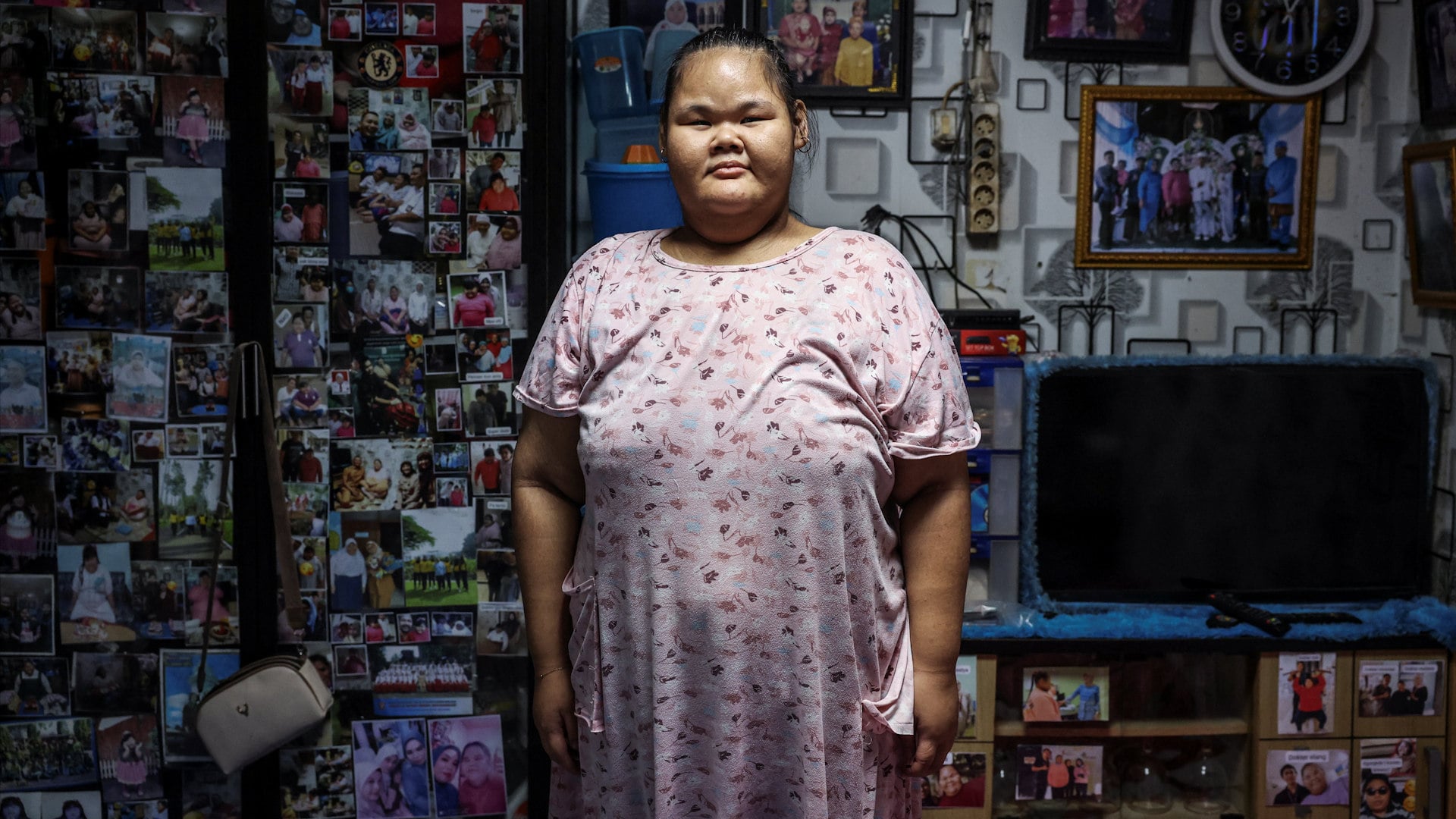 Intan Permatasari, 15, poses for a photograph at her home in Bogor, West Java province, Indonesia, August 20, 2026. Intan’s confidence has returned as her weight has dropped. She goes to the gym, eats out with her parents, and returned to school last month. She still dreams of becoming a police officer. “They like to help people,” Intan said. “I want to prove to people who bully me, who make fun of me, that I can be a hero.”