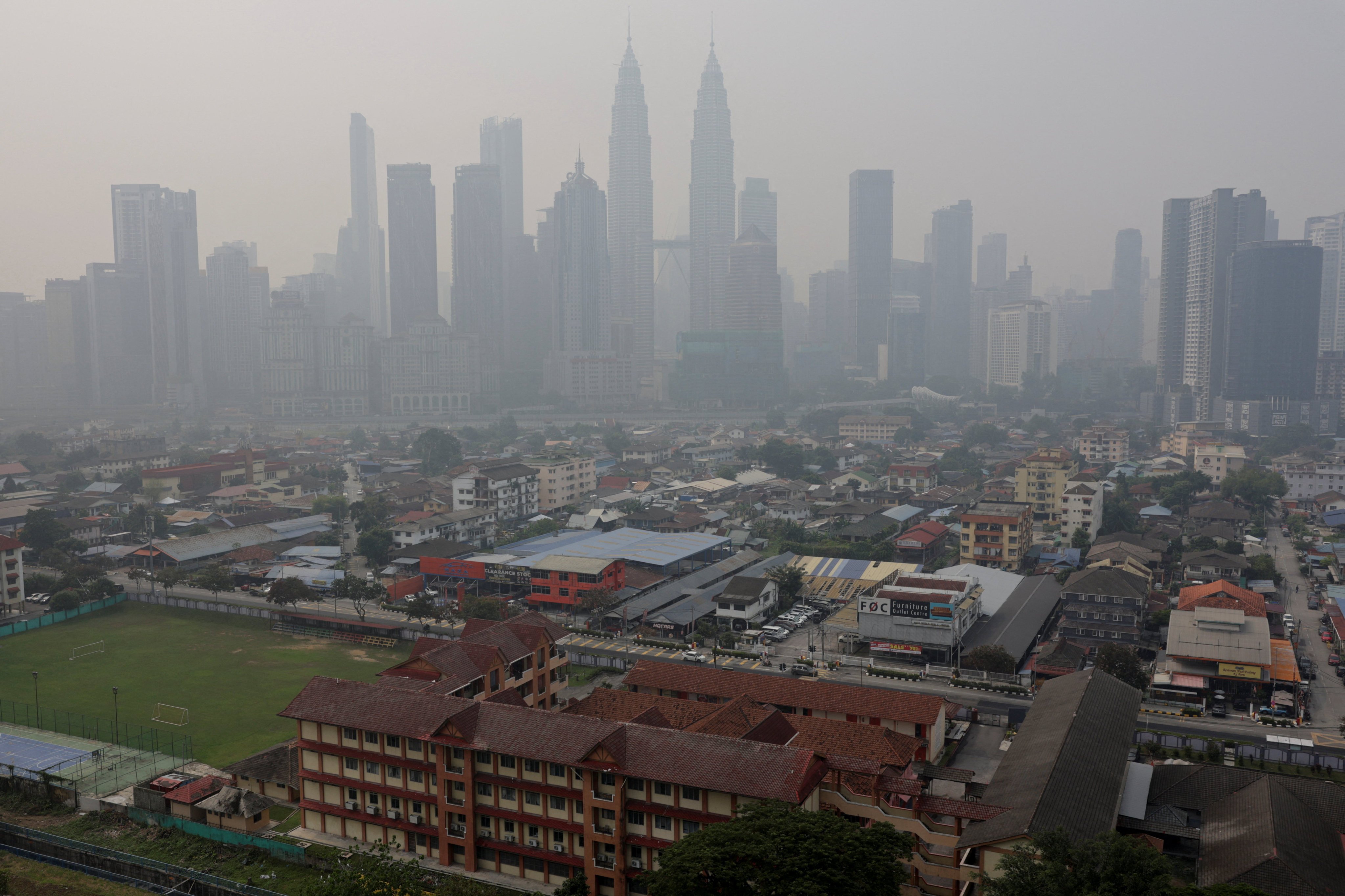 Kuala Lumpur’s skyline is shrouded in haze from regional wildfires on Friday. Photo: Reuters