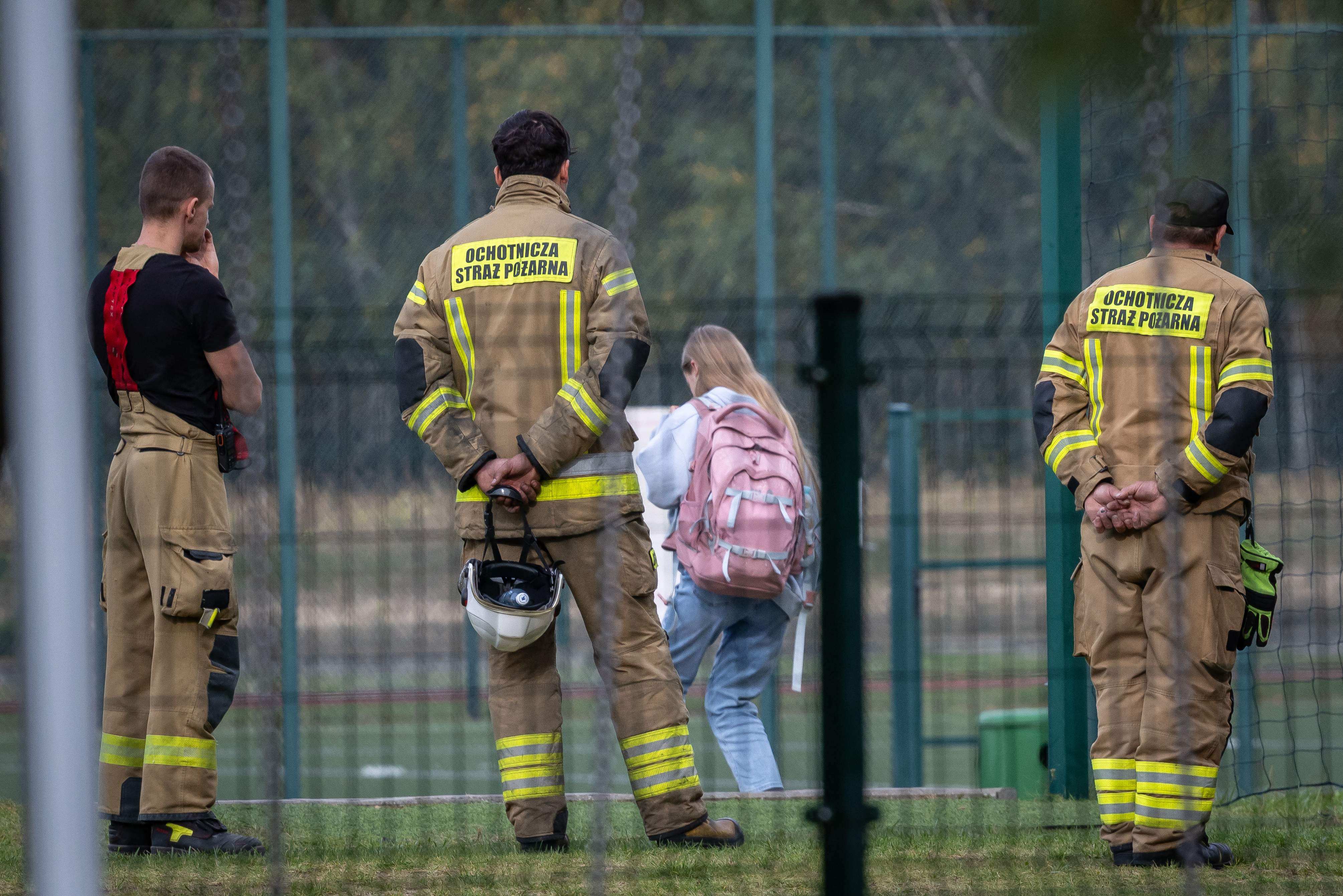 A girl leaves the school grounds where a 15-year-old fatally stabbed the caretaker at the John-Paul II primary school in Leszczydol-Nowiny, Poland and wounded two other adults on Thursday. Photo: AFP