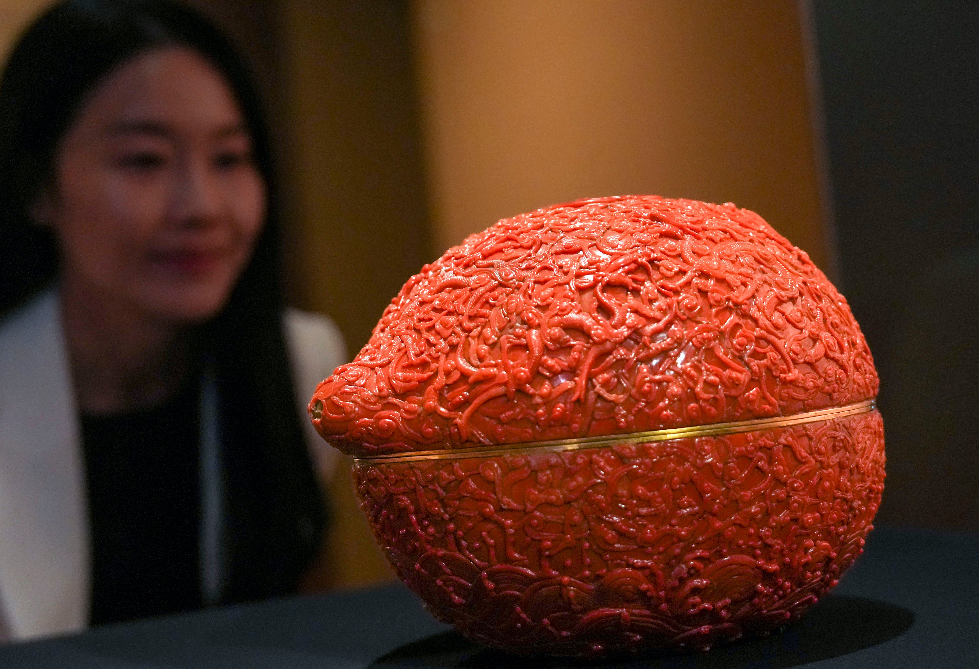 A peach-shaped box with dragons, clouds, waves and the Chinese character for longevity (“shou”) at the exhibition “Design for the Forbidden City: Imperial Workshops of the Qing Court”, at Hong Kong Palace Museum, in West Kowloon Cultural District. Photo: Kit Lai