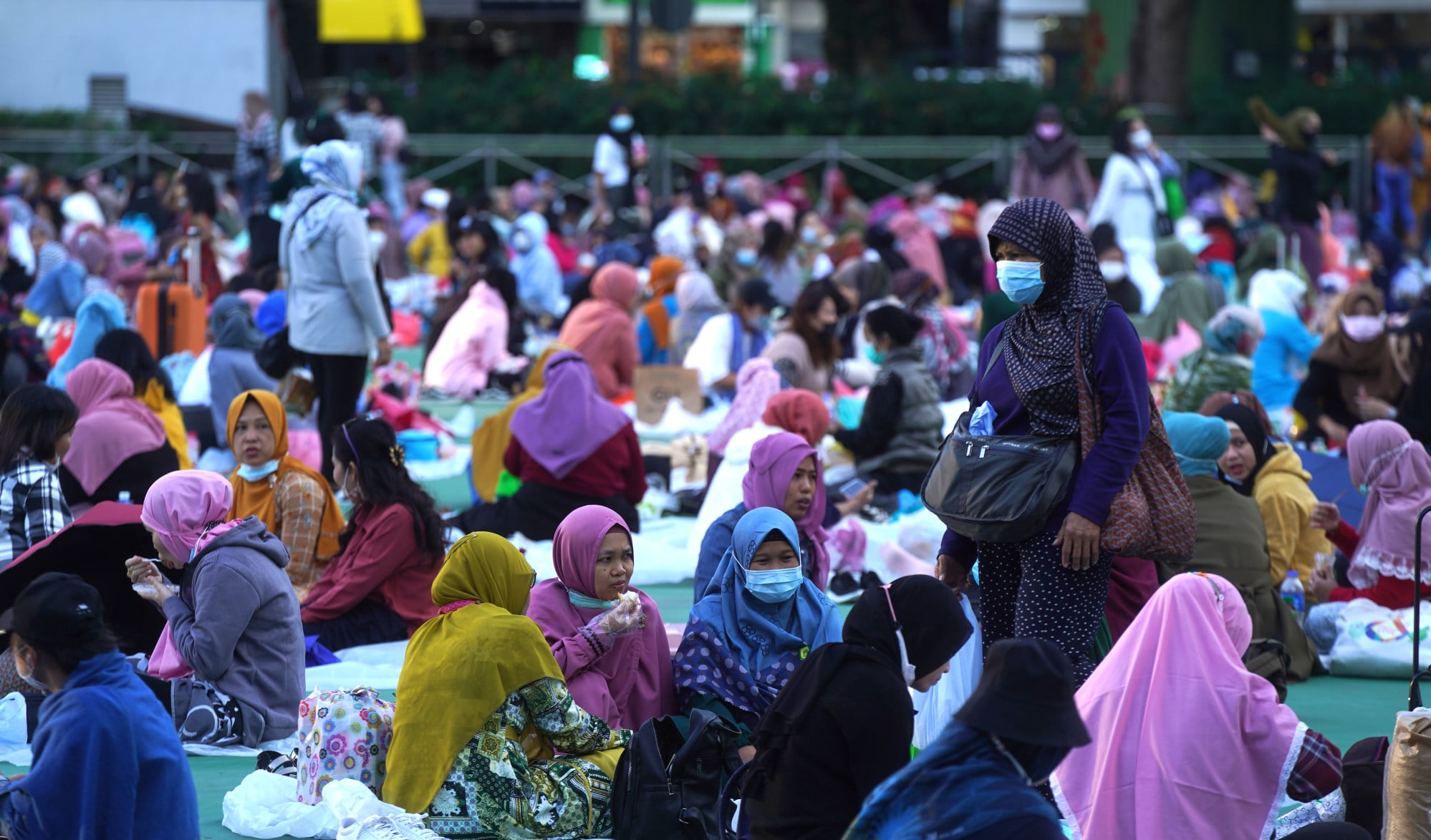 Foreign domestic workers enjoy a day off at Victoria Park in Hong Kong. Photo: Sam Tsang