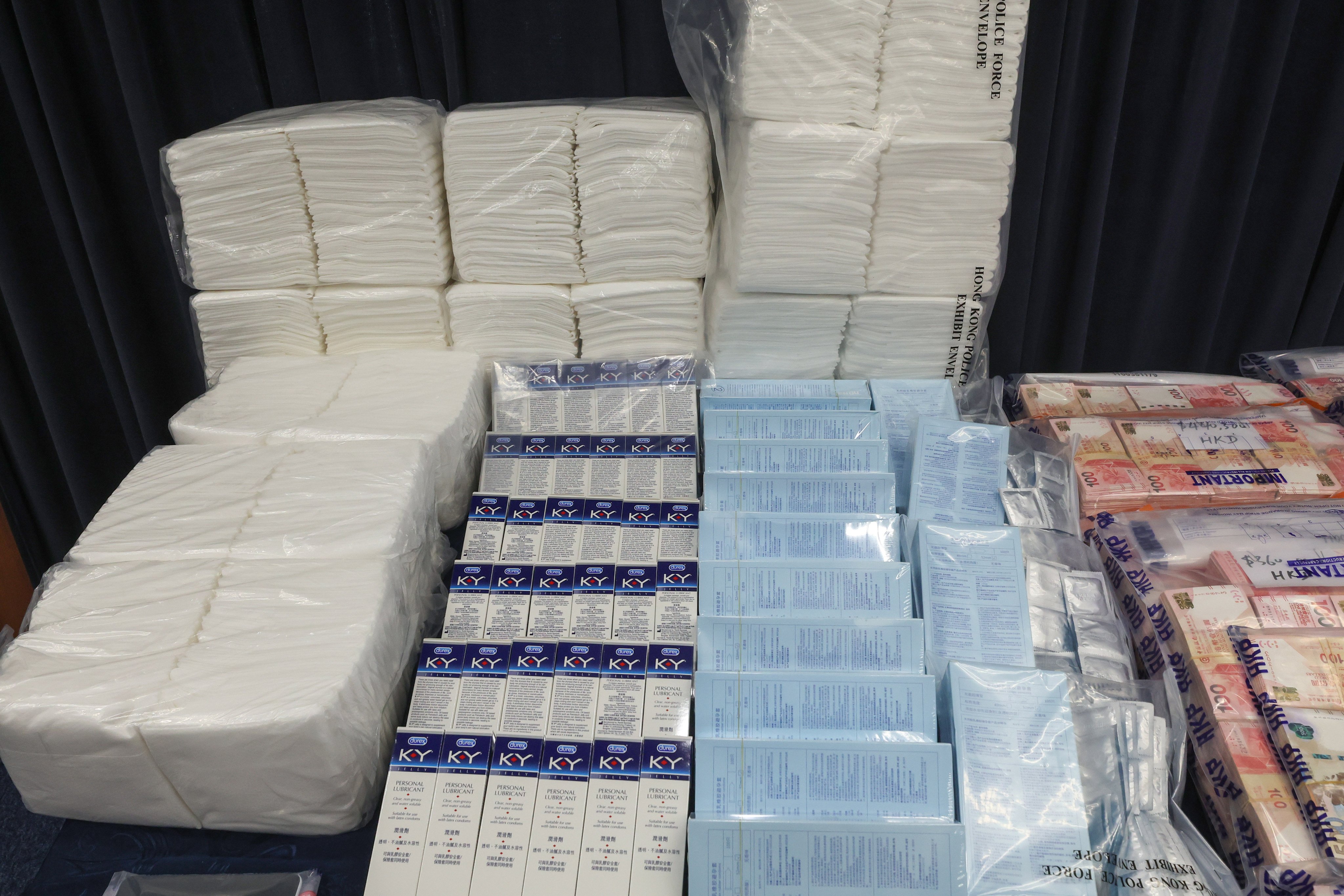 Police display items seized during a raid at a private housing estate in Tuen Mun. Photo: Edmond So