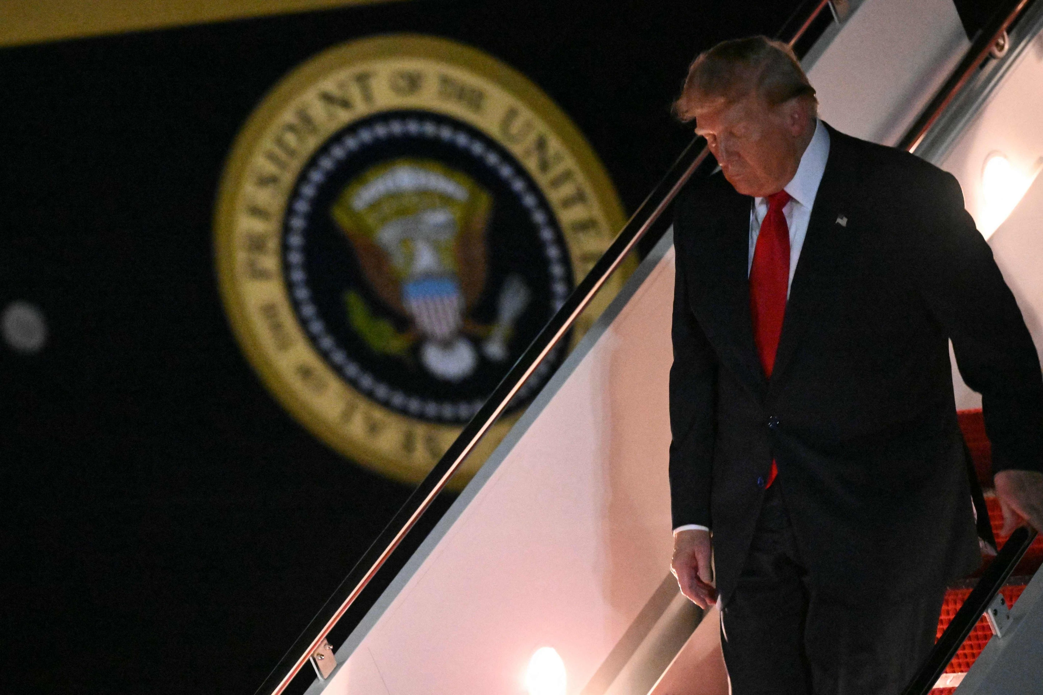US President Donald Trump steps off Air Force One at Joint Base Andrews, Maryland, on Friday. Photo: AFP