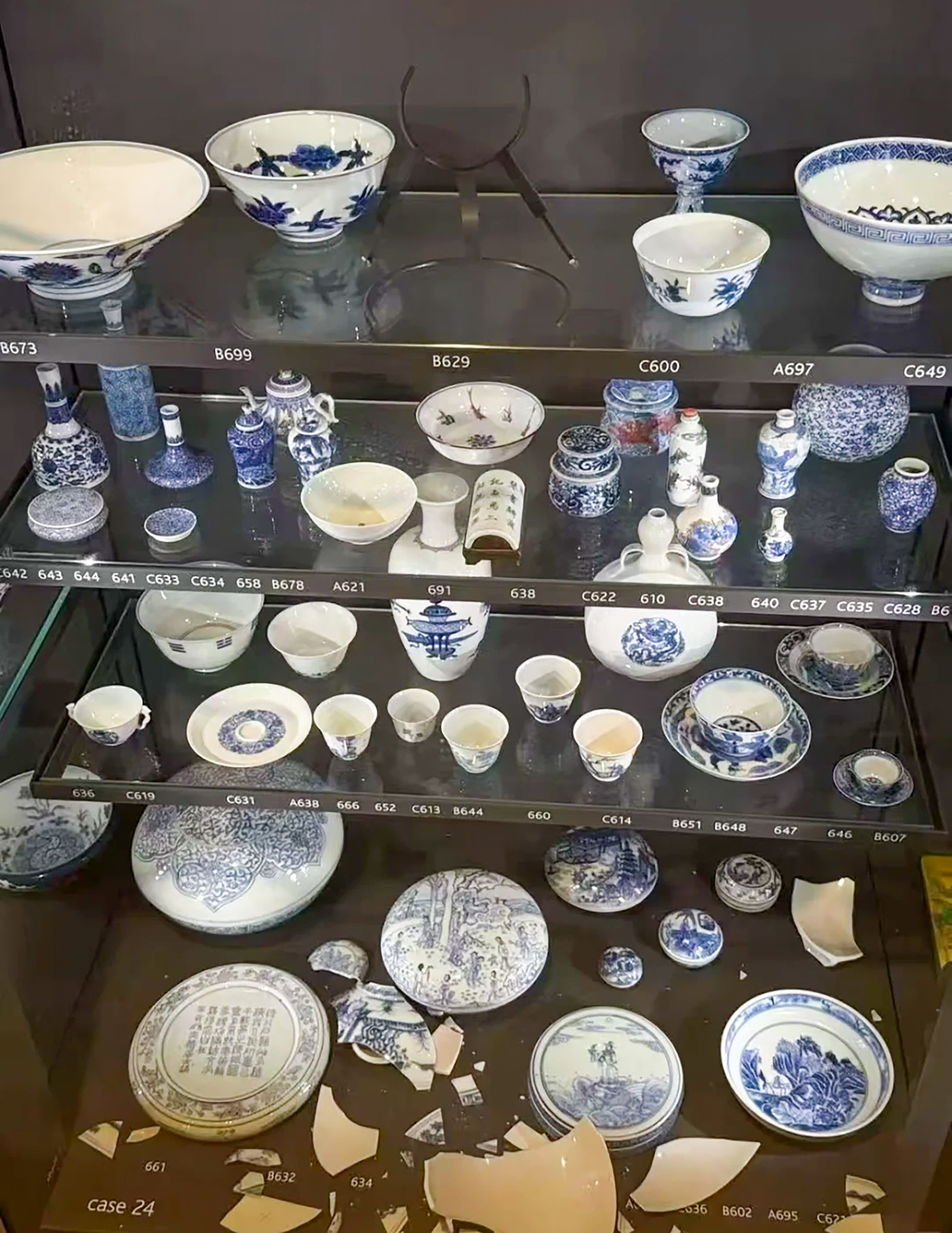 A photo circulating on social media showed debris from two damage Chinese artefacts inside a four-tier display cabinet at the British Museum: a bowl catalogued as B629 that fell from the top shelf and item 634, damaged by the falling bowl. Photo: RedNote
