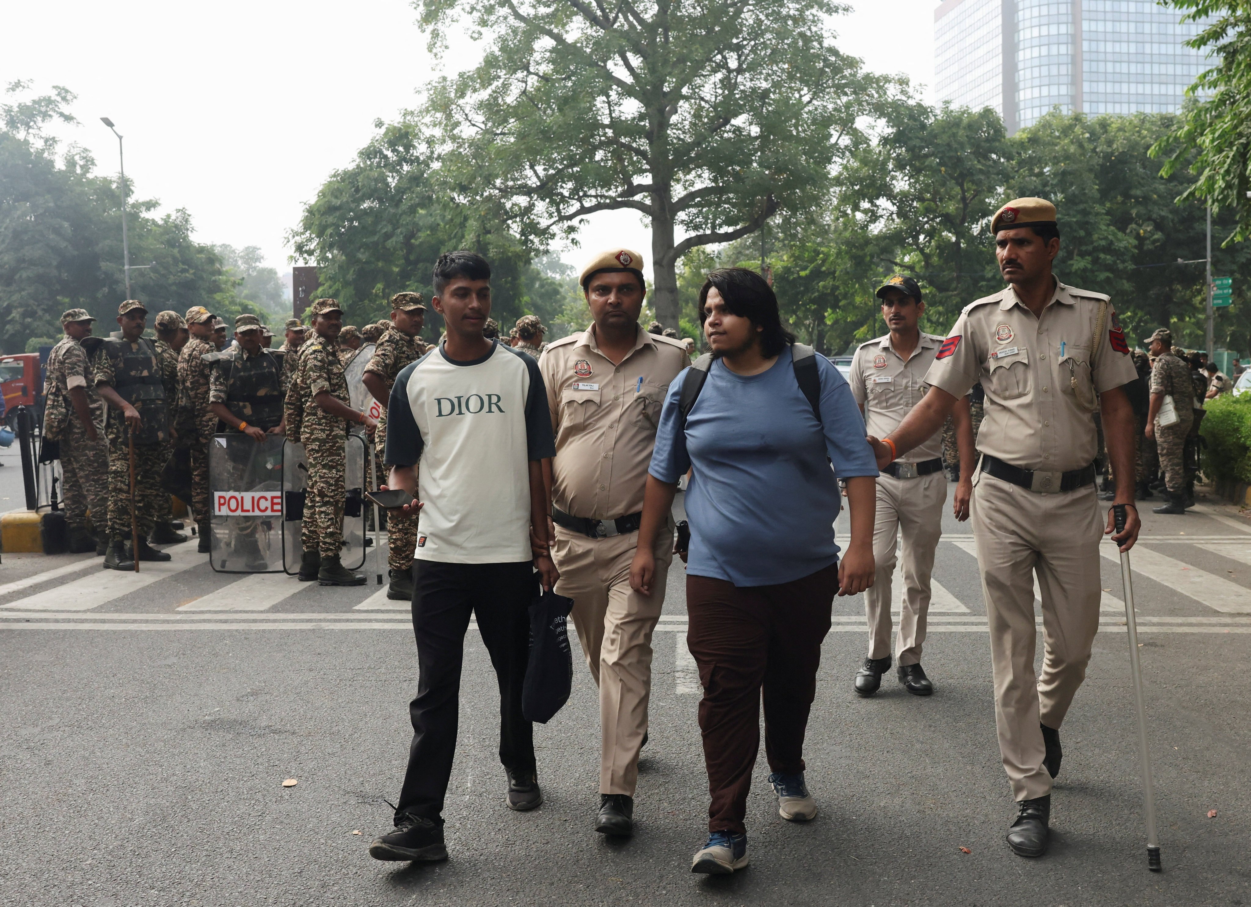 Security personnel detain protestors demanding the resignation of India’s election chief in New Delhi on Saturday. Photo: Reuters