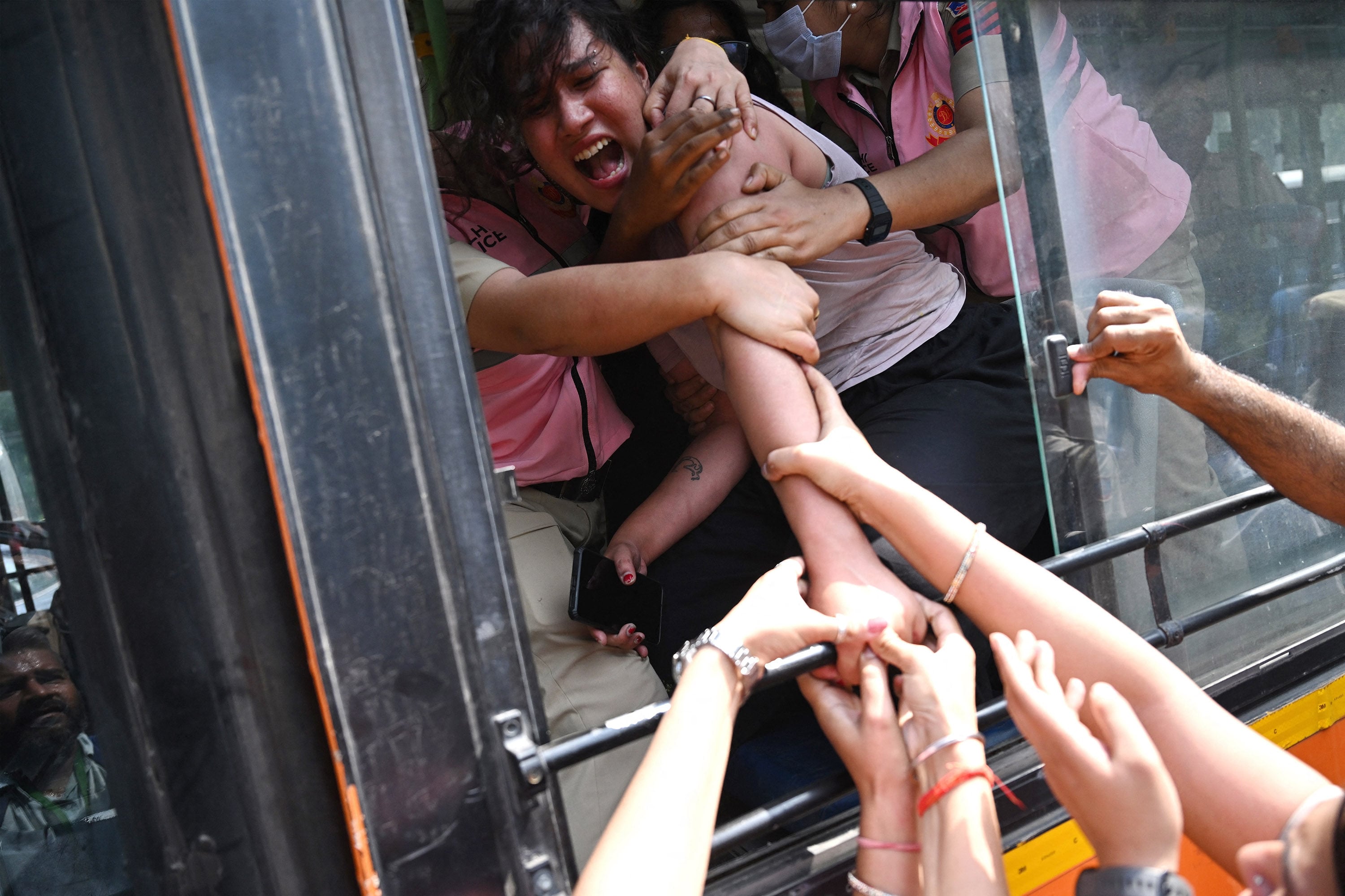 Police detain a supporter of the Cockroach Janta Party during a protest demanding the resignation of India’s chief election commissioner in New Delhi on Saturday. Photo: AFP/Getty Images/TNS