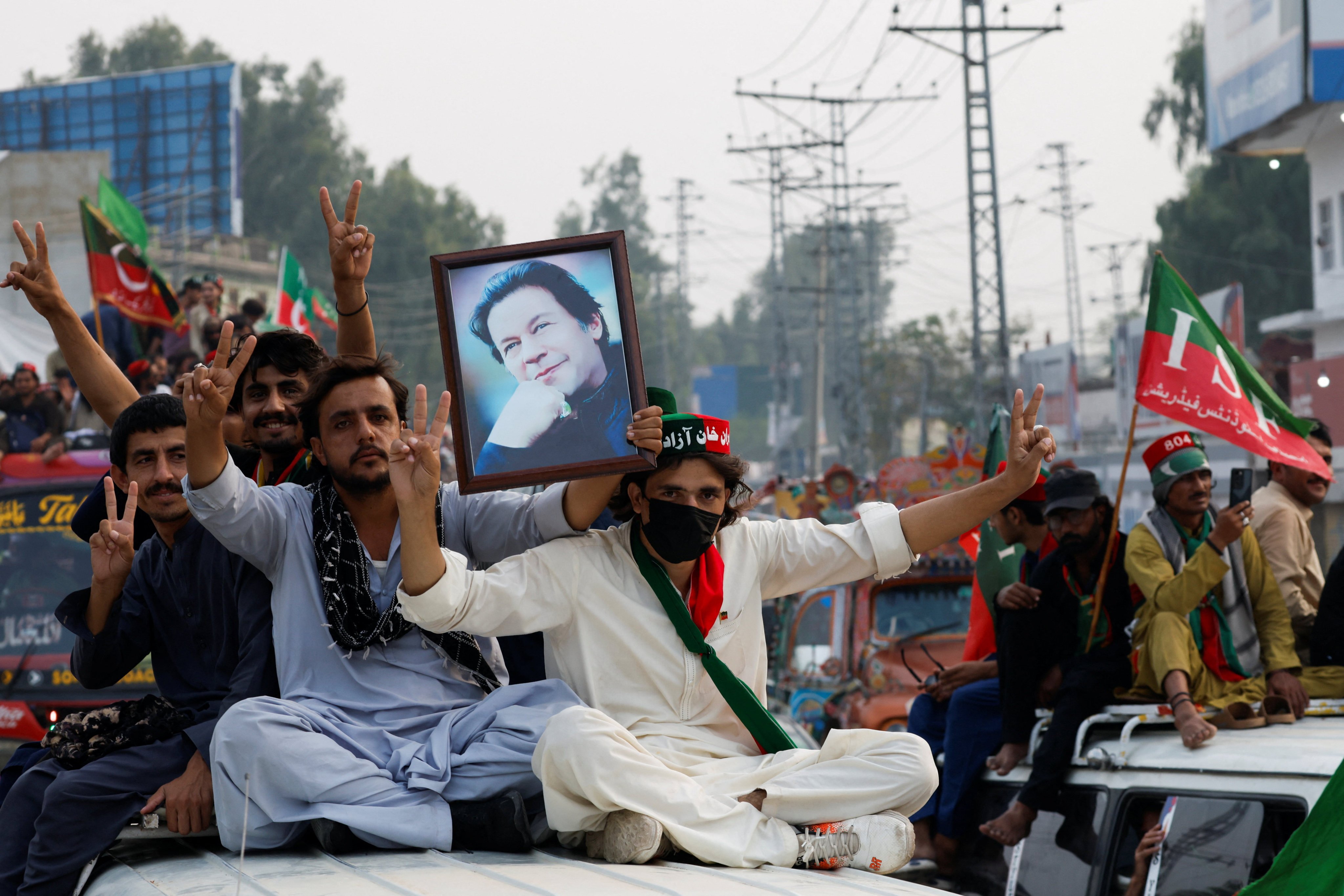 Supporters of former Pakistani Prime Minister Imran Khan’s party take part in a protest march on the outskirts of Peshawar, Khyber Pakhtunkhwa province on Thursday. Photo: Reuters
