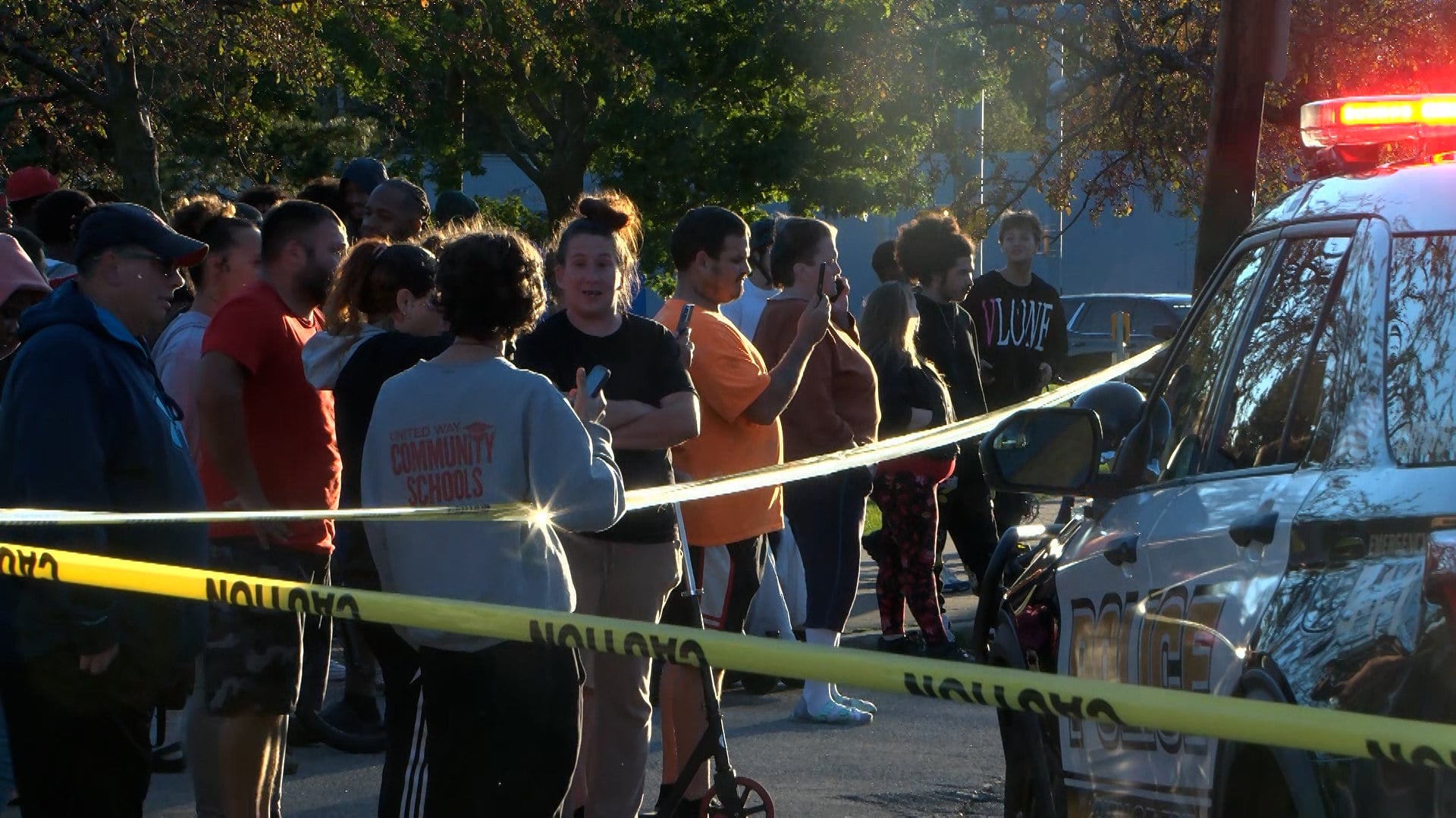 Bystanders gather outside the scene of a shooting in Erie, Pennsylvania, on Friday evening. Photo: WJET via AP