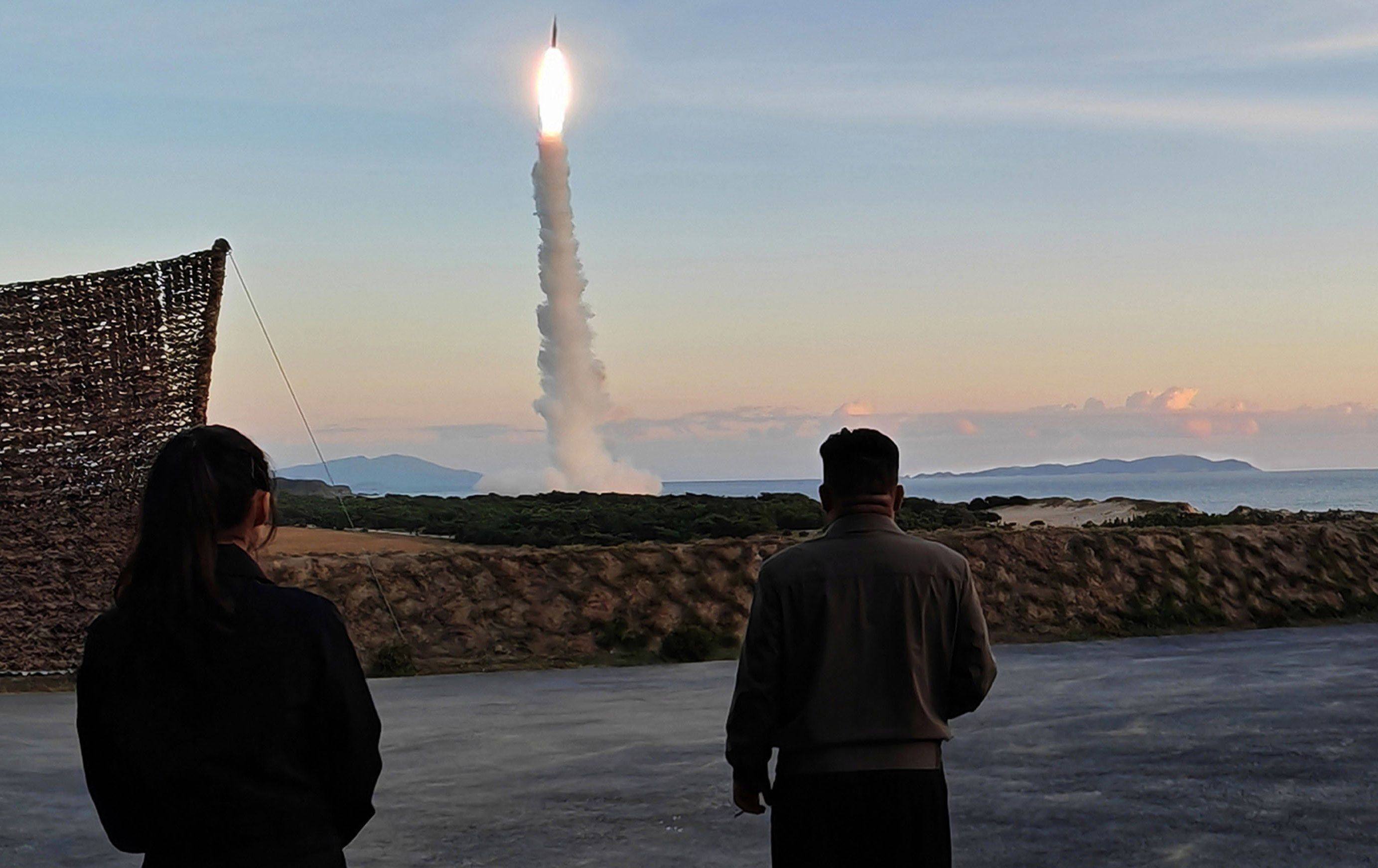 North Korean leader Kim Jong-un and his daughter (left) observe a ballistic missile launch in the country’s eastern region on October 3. Photo: KCNA/KNS/dpa