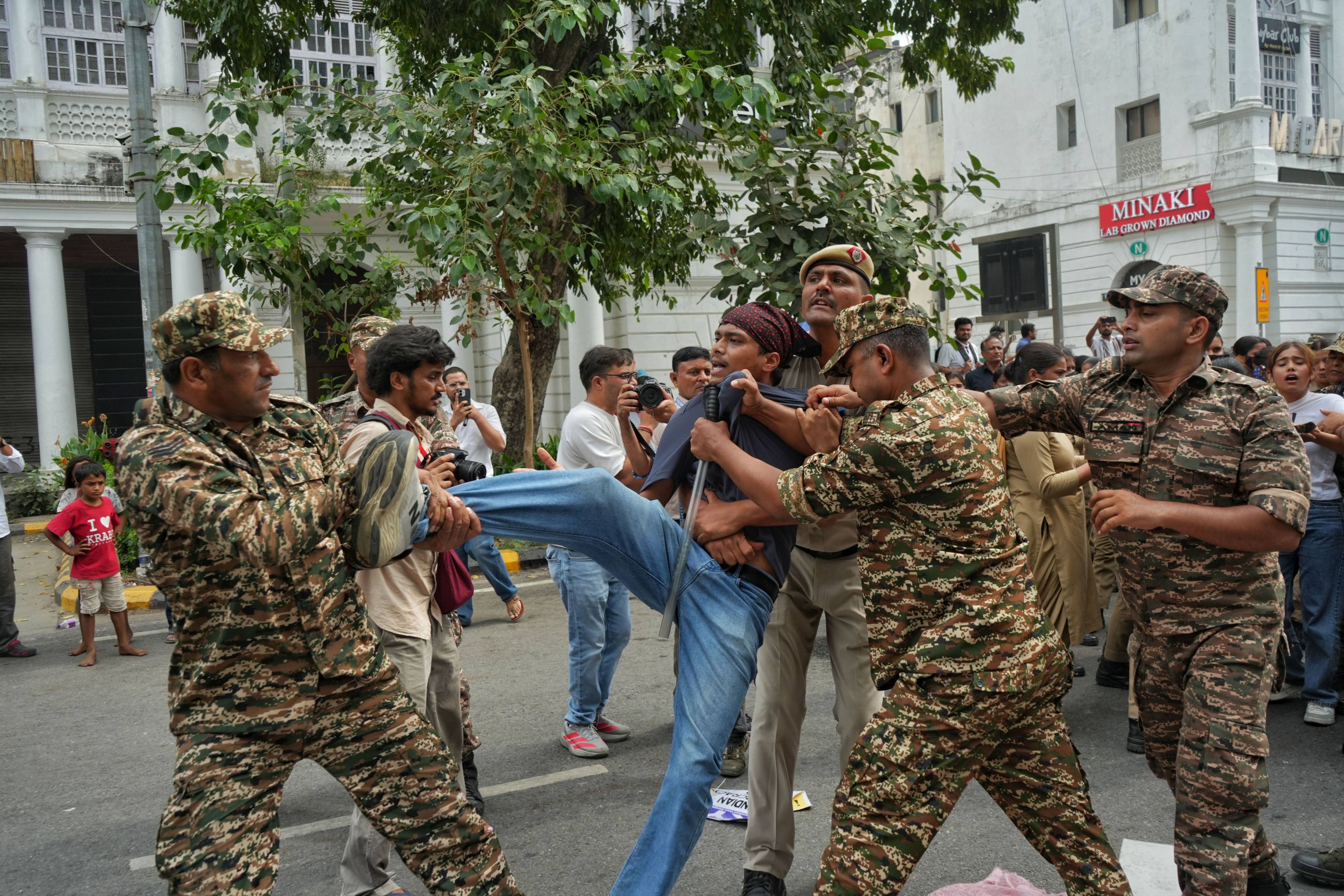 Police detain a protester during a demonstration demanding the resignation of India’s election commission chief at Jantar Mantar in New Delhi on Sunday. Photo: dpa