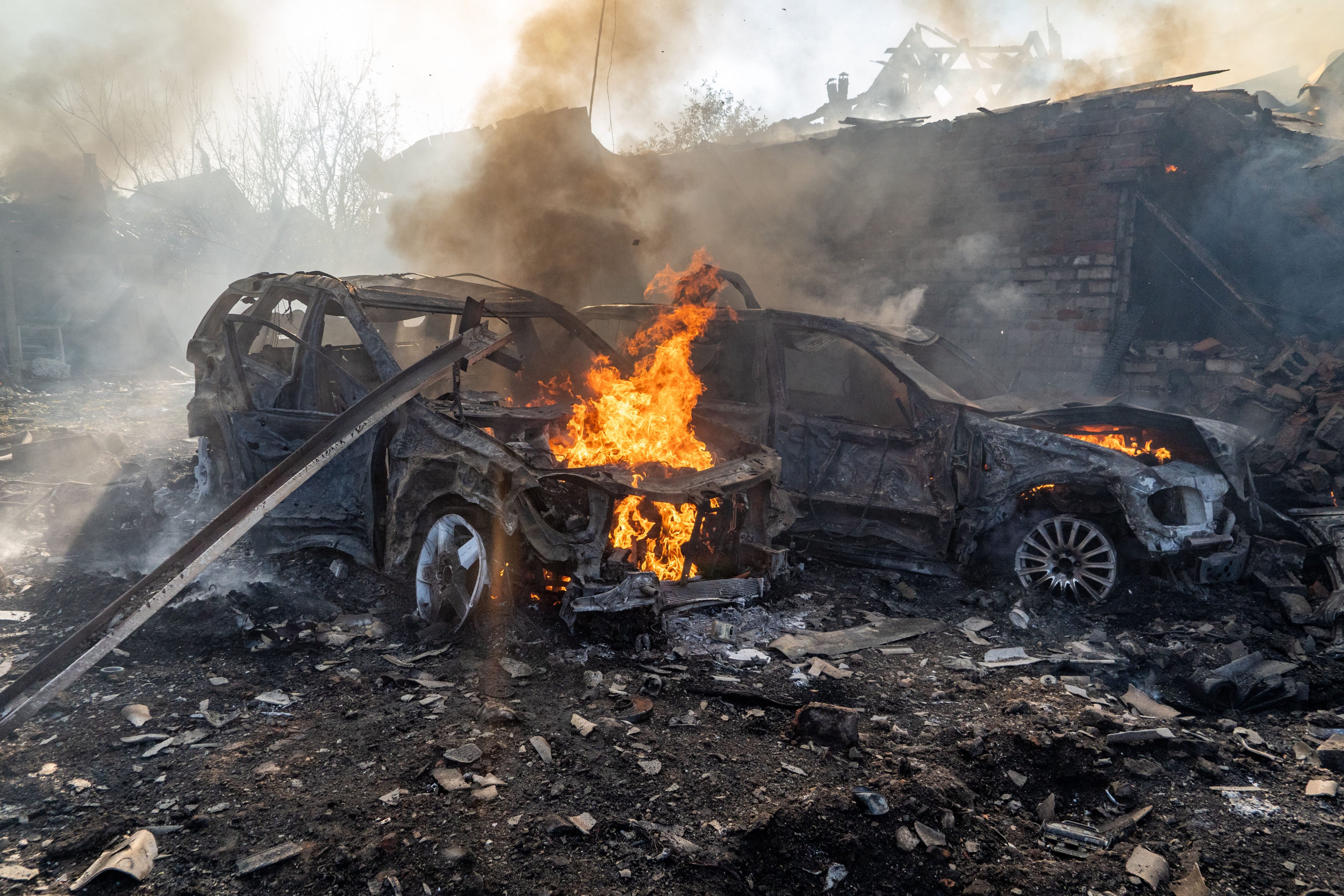 Cars burn after a Russian strike on a residential neighbourhood in Kharkiv, Ukraine, on October 11, 2026. Photo: AP