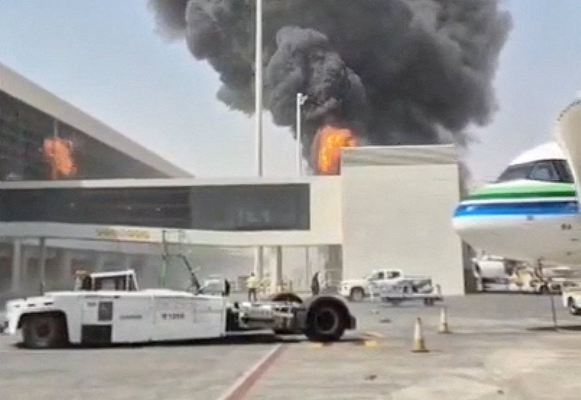 Smoke and flames rise from Riyadh’s King Khalid International Airport after an attack on October 8, 2026. Photo: Social media via Reuters
