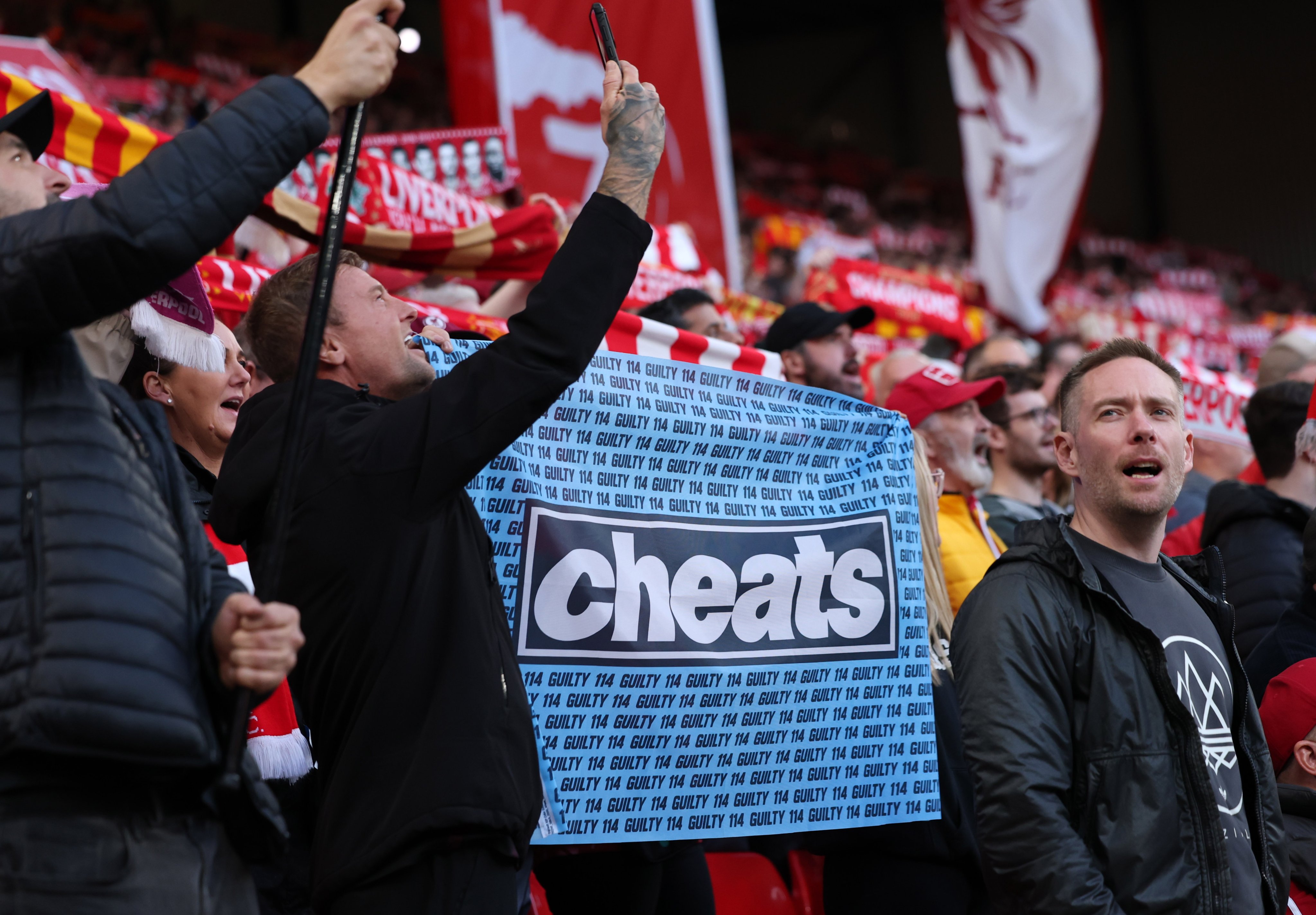 A banner from Liverpool supporters references Manchester City being found guilty of breaking Premier League financial regulations, during the match at Anfield on Sunday. Photo: EPA
