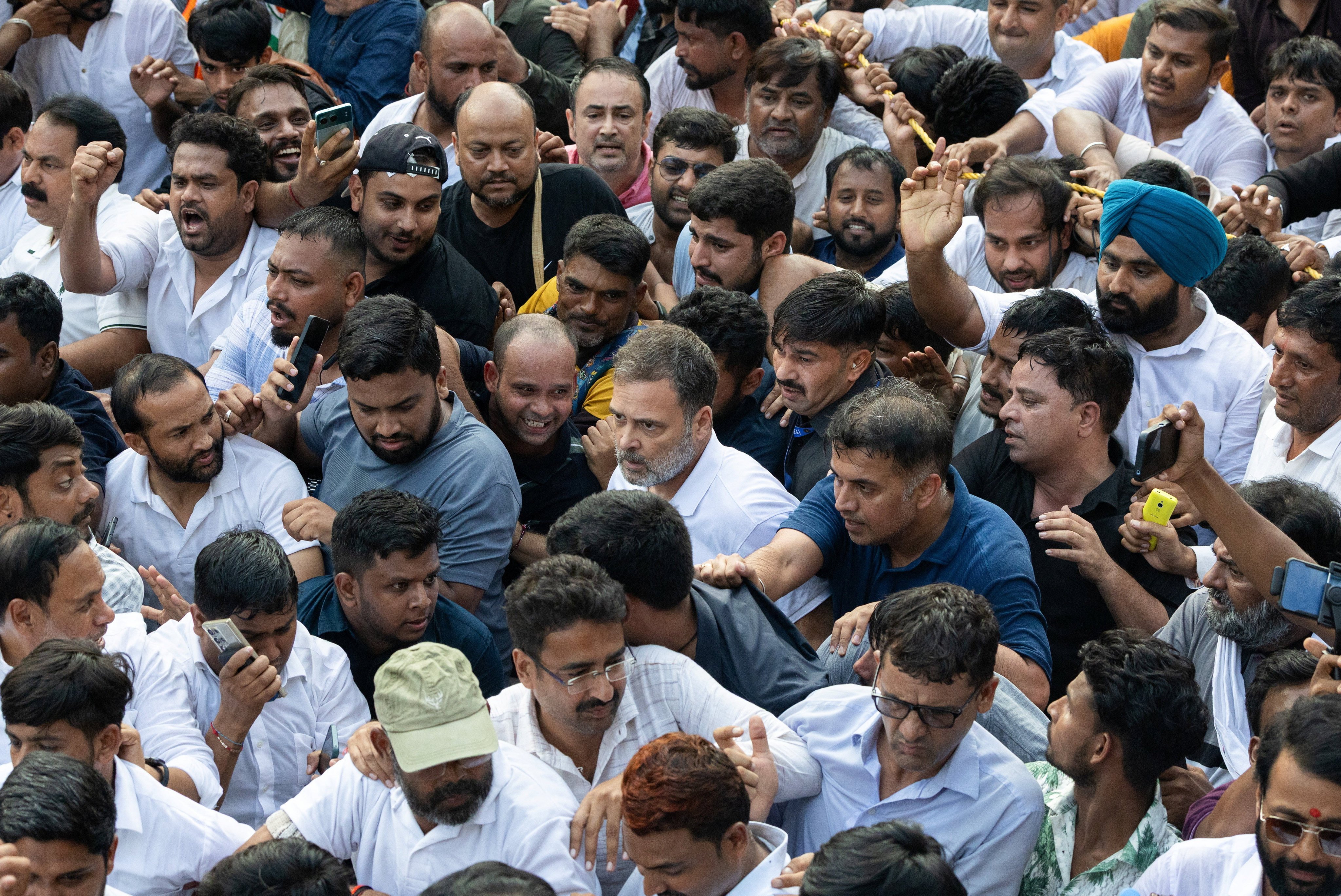 Indian opposition leader Rahul Gandhi marches with supporters towards the Supreme Court in New Delhi, India, on Monday. Photo: Reuters