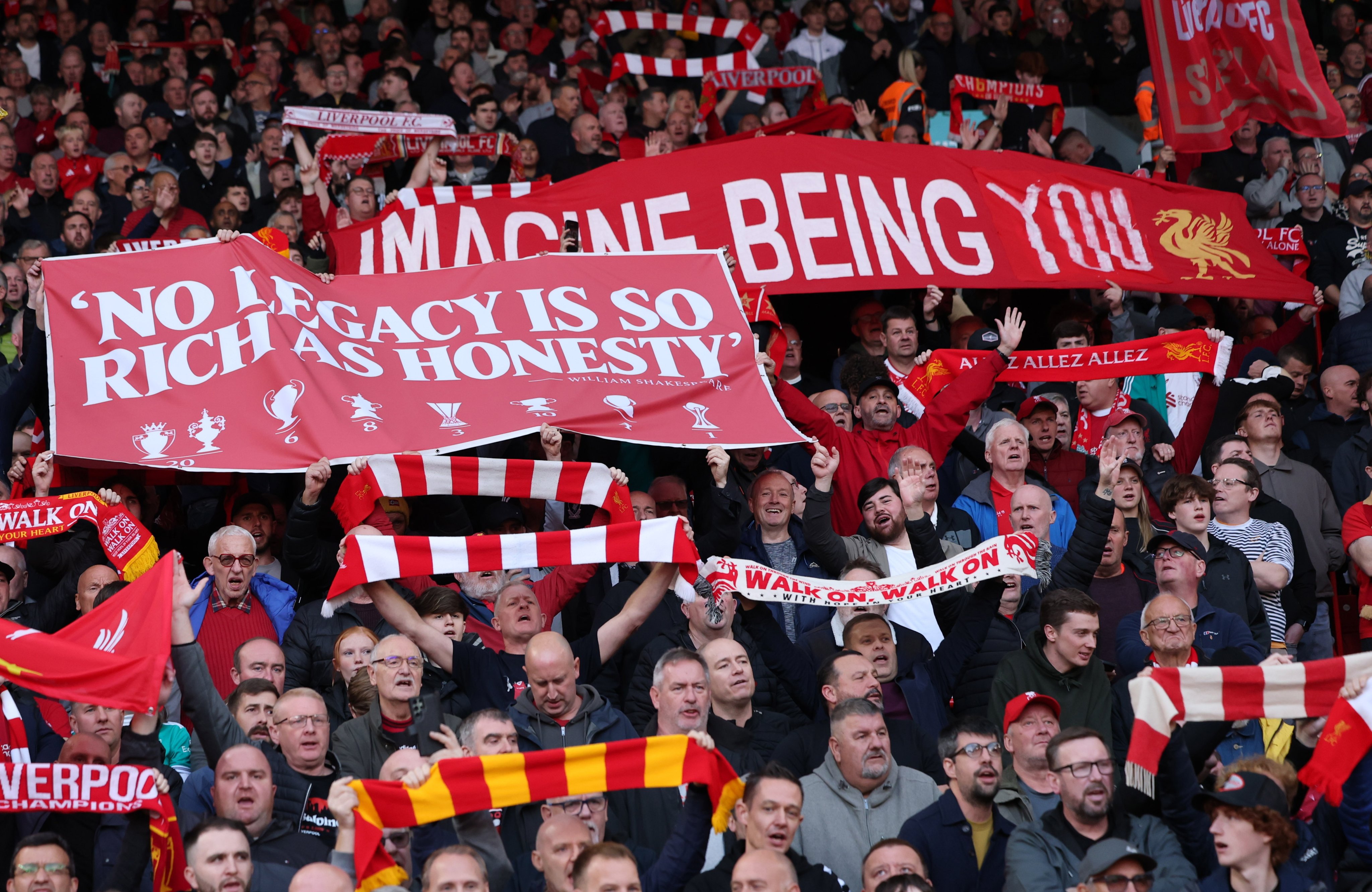 A banner from Liverpool supporters references Manchester City being found guilty of breaking Premier League financial regulations, during the match at Anfield on Sunday. Photo: EPA