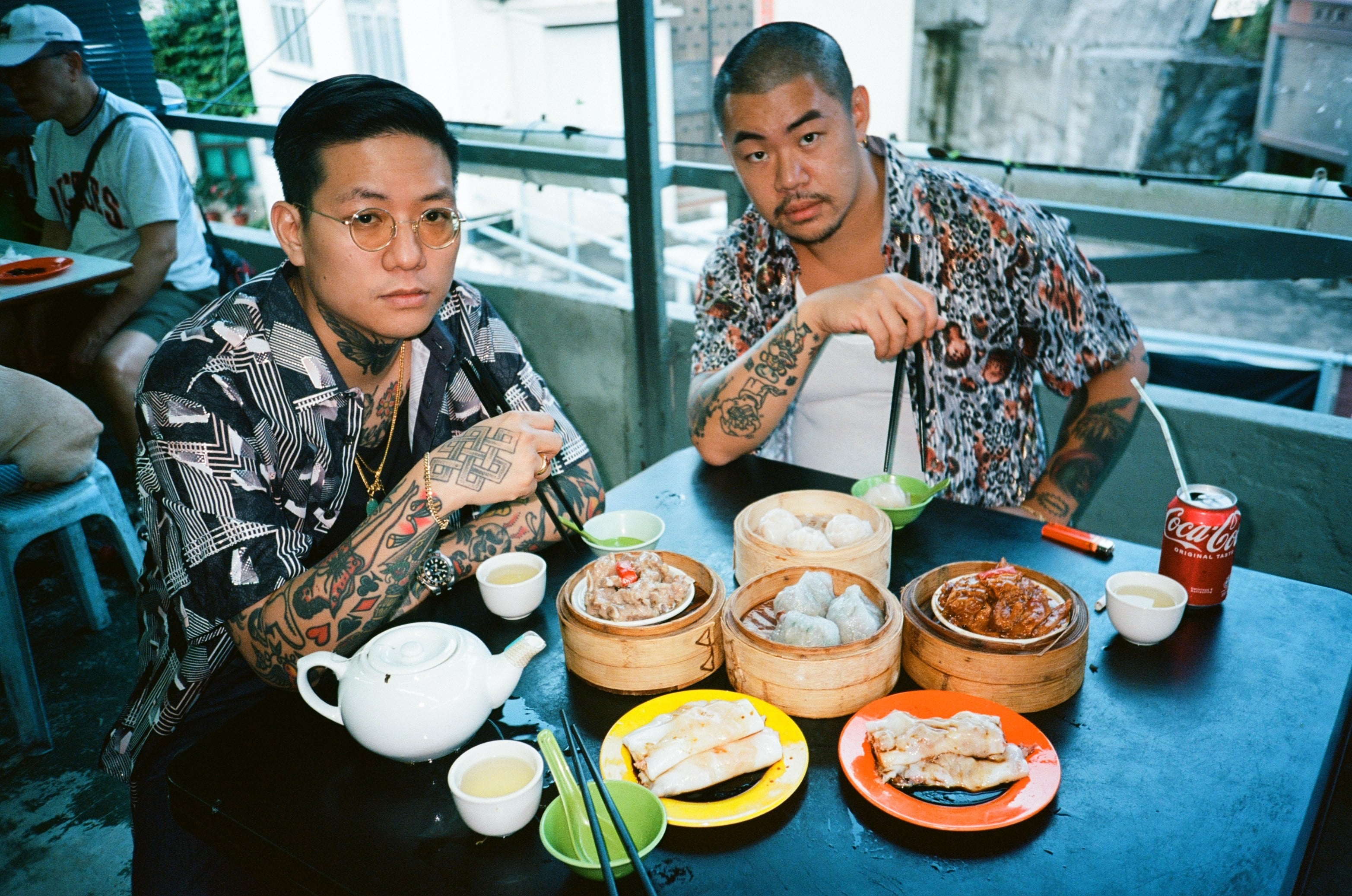 Tattoo artist Jimmy Shy (left) and photographer Yu Chang took to the streets of Hong Kong to photograph people with tattoos. Their work has been made into a photobook, Hong Kong Traditional Tattoo. Photo: courtesy of Jimmy Shy