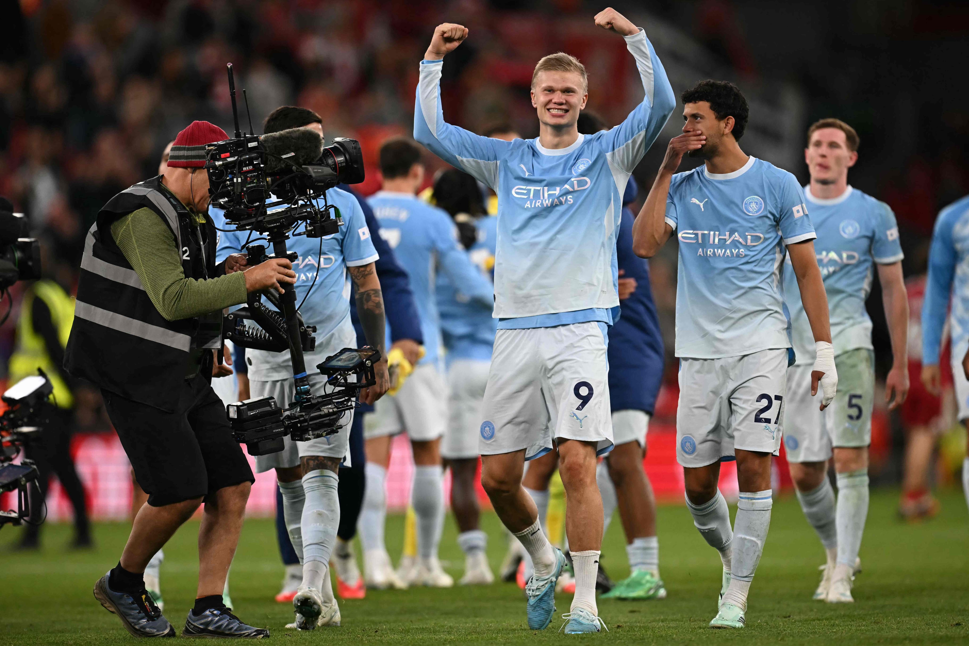 Manchester City striker Erling Haaland (centre) celebrates after his side’s comprehensive win at Anfield. Photo: AFP