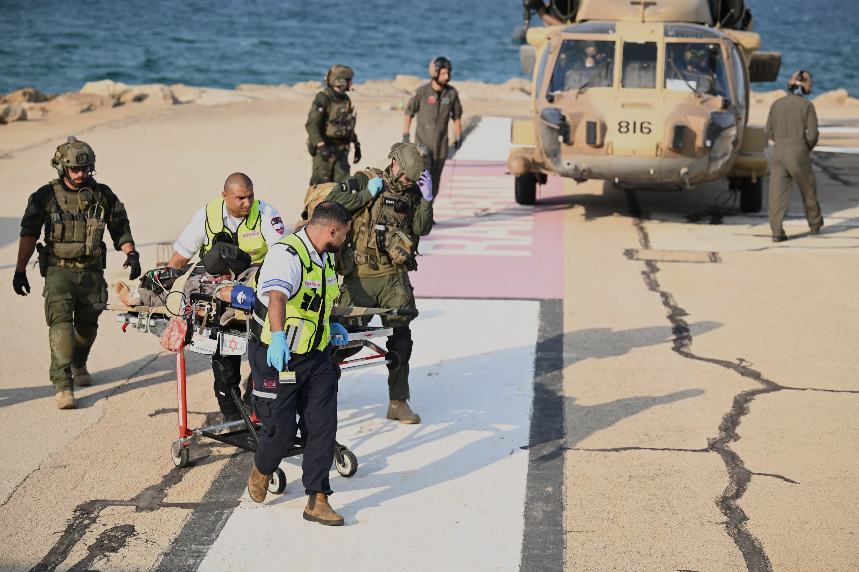 Israeli medics rush an injured person for treatment in Haifa, Israel, following an explosion in northern Israel near the border with Lebanon. Photo: AP