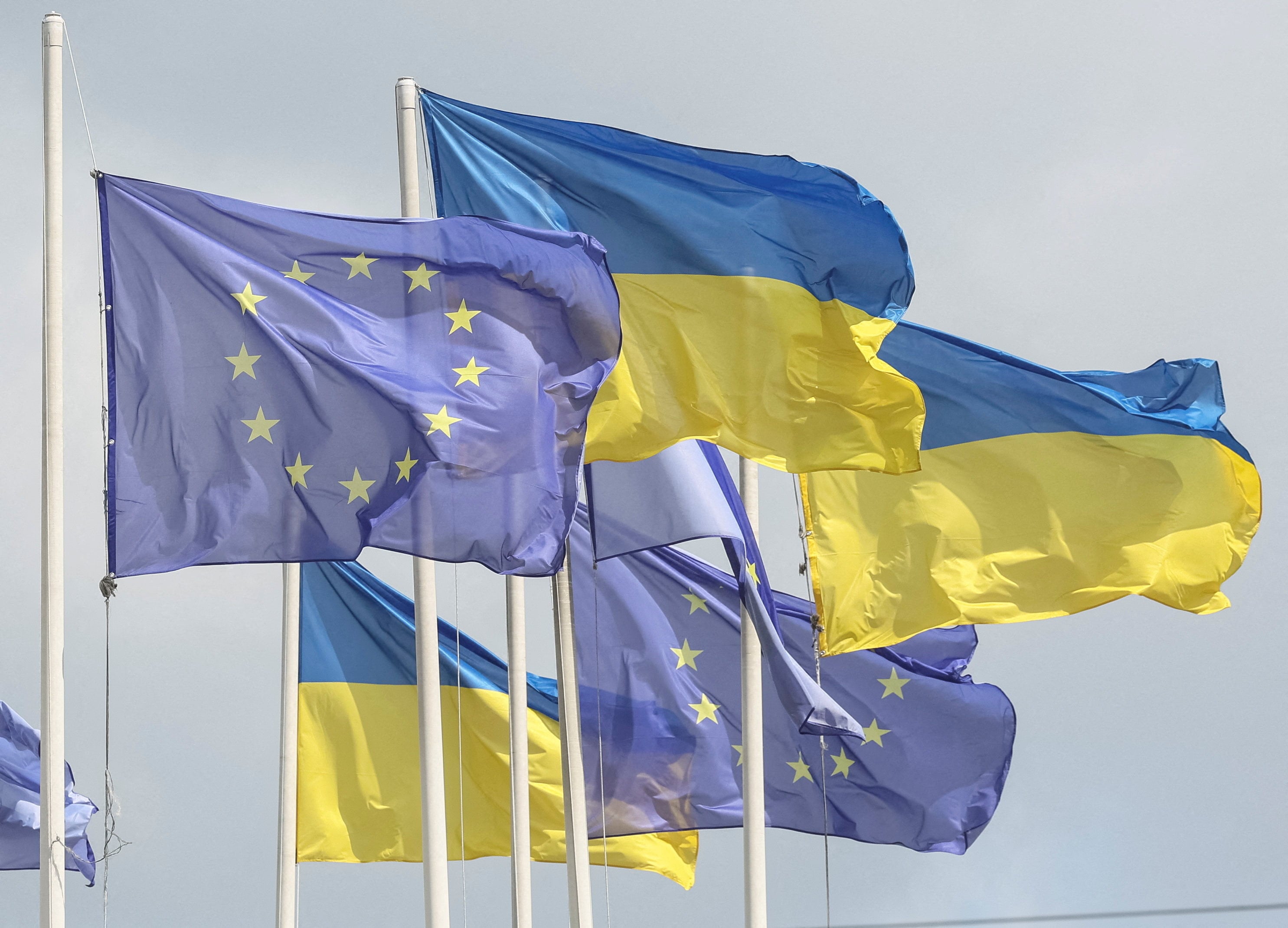 Ukrainian and European Union flags fly in Kyiv. Photo: Reuters