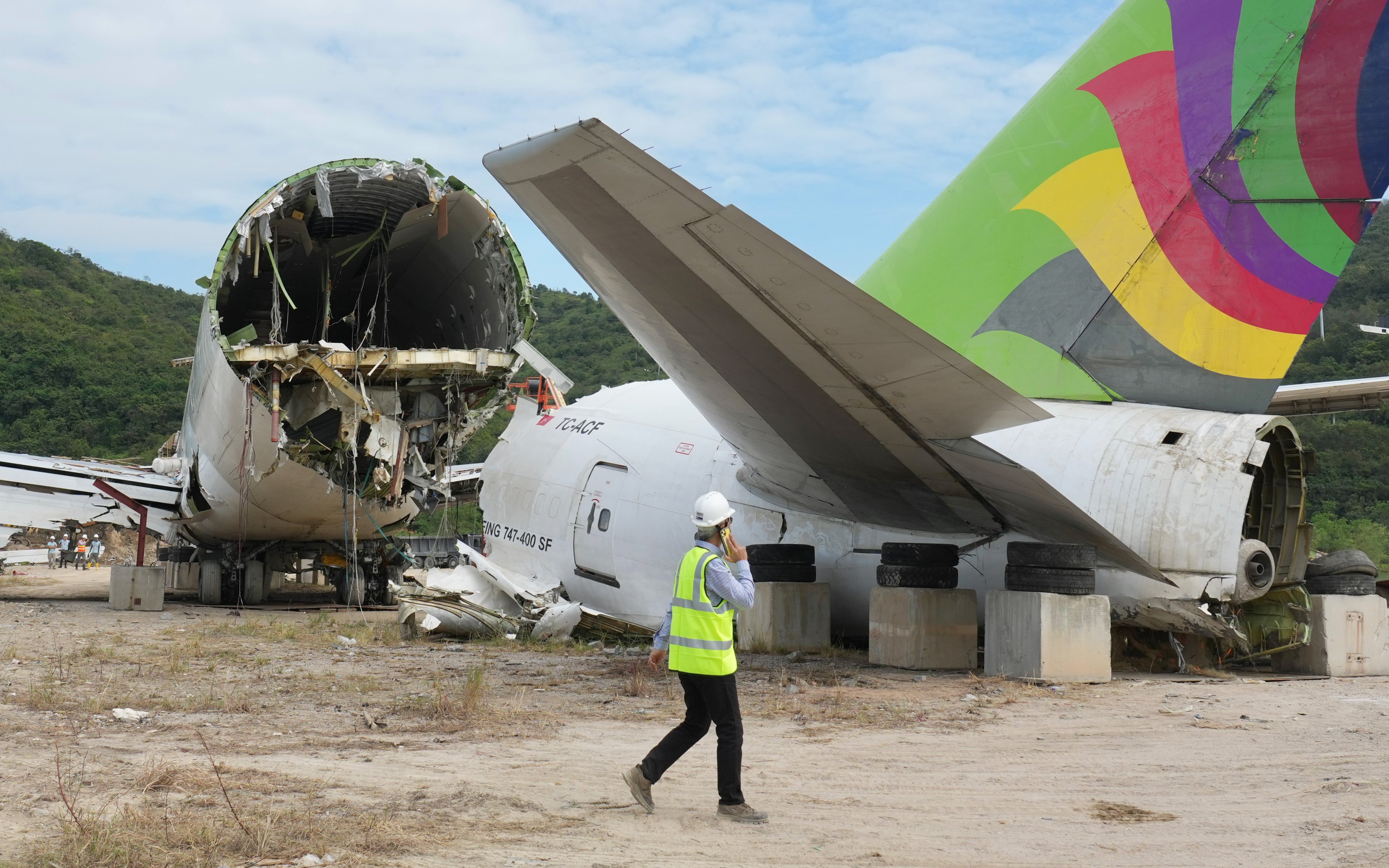 The aircraft crashed into a ground security vehicle parked outside the runway boundary and killed two people inside. Photo: Karma Lo