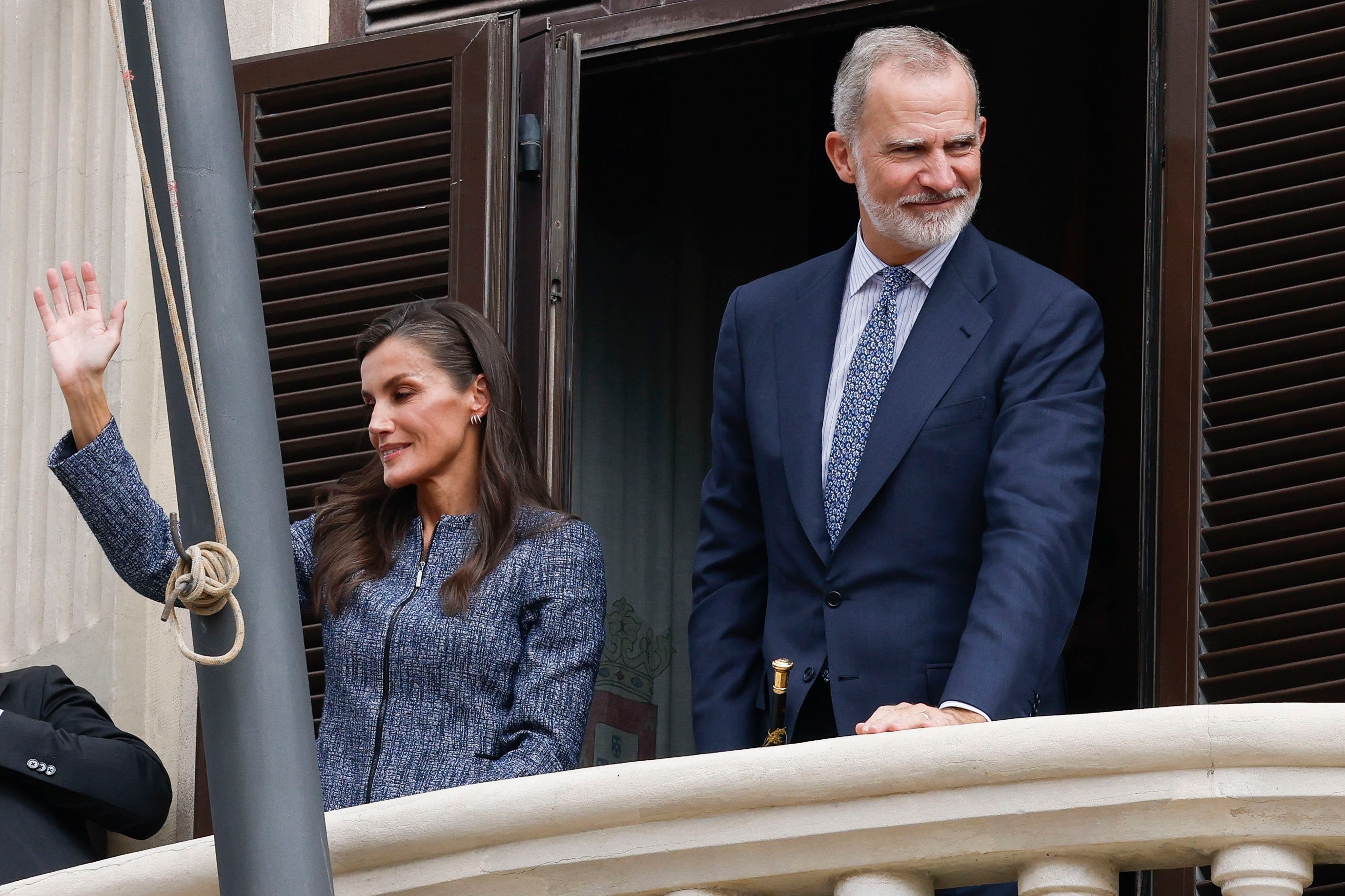 Spain’s King Felipe VI (right) and Queen Letizia wave from the Town Hall balcony in Ceuta, Spain, on Tuesday. Photo: EPA