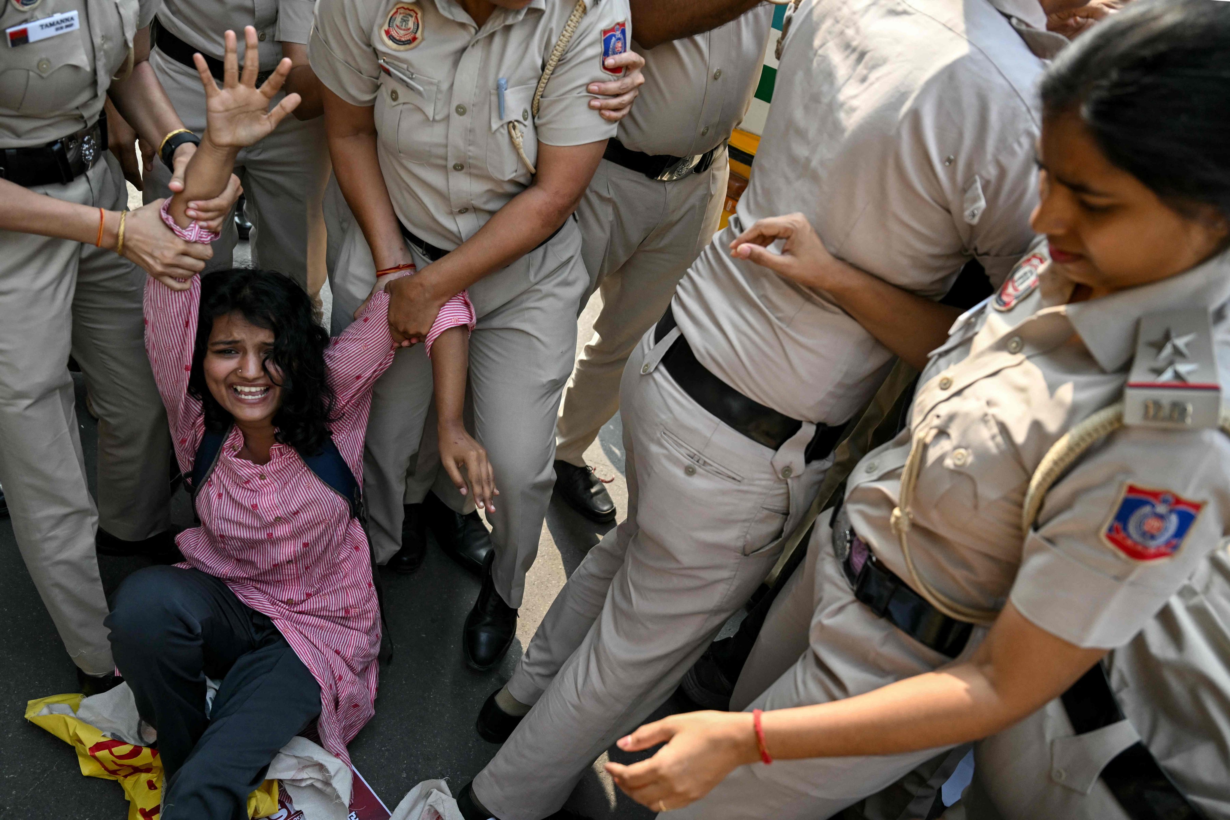 Police detain a student protester demanding the resignation of India’s election chief in New Delhi, on Tuesday. Photo: AFP