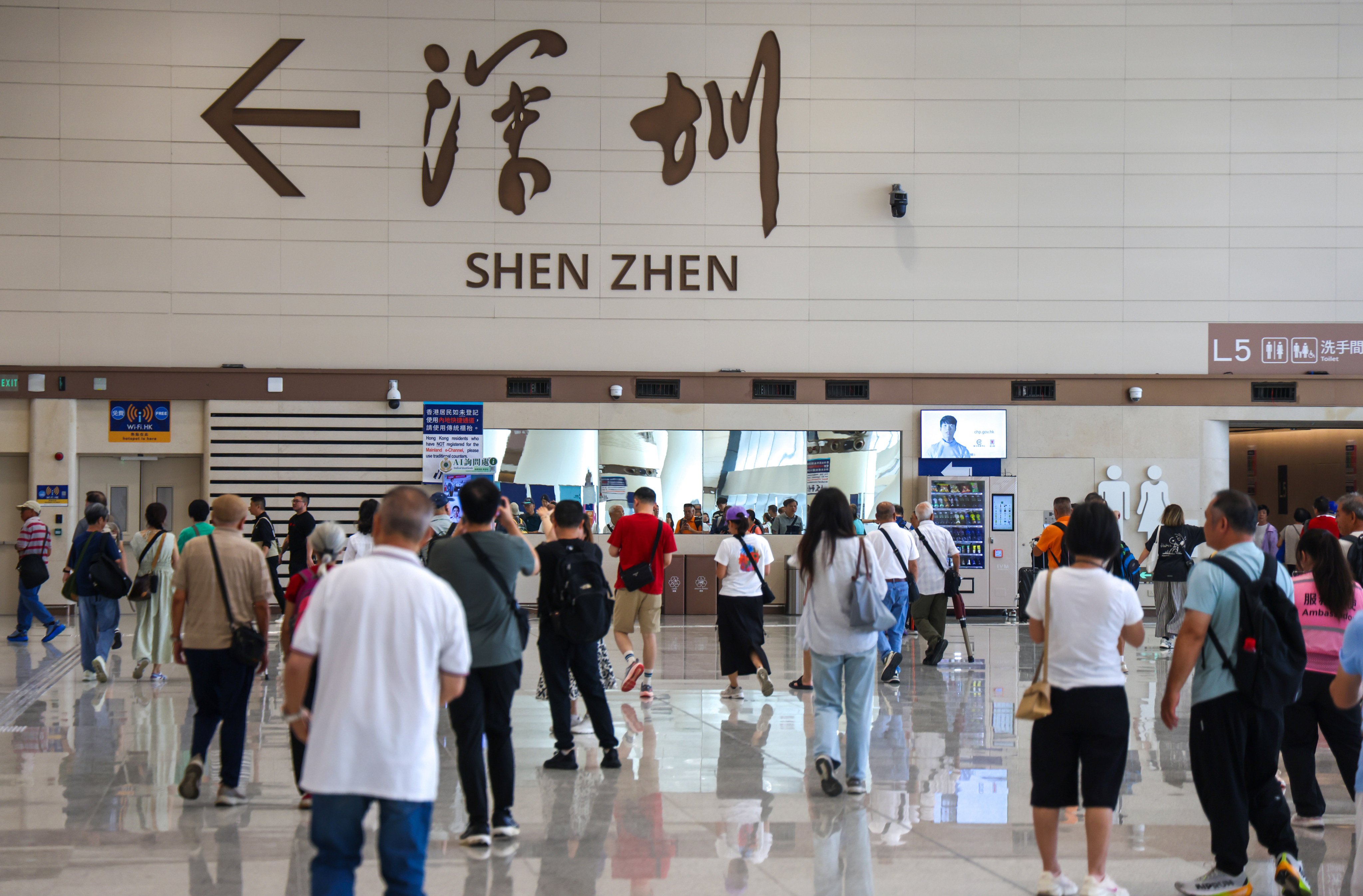 Travellers at the revamped Huanggang Port on its opening day on Monday. Photo: Silvia Siu
