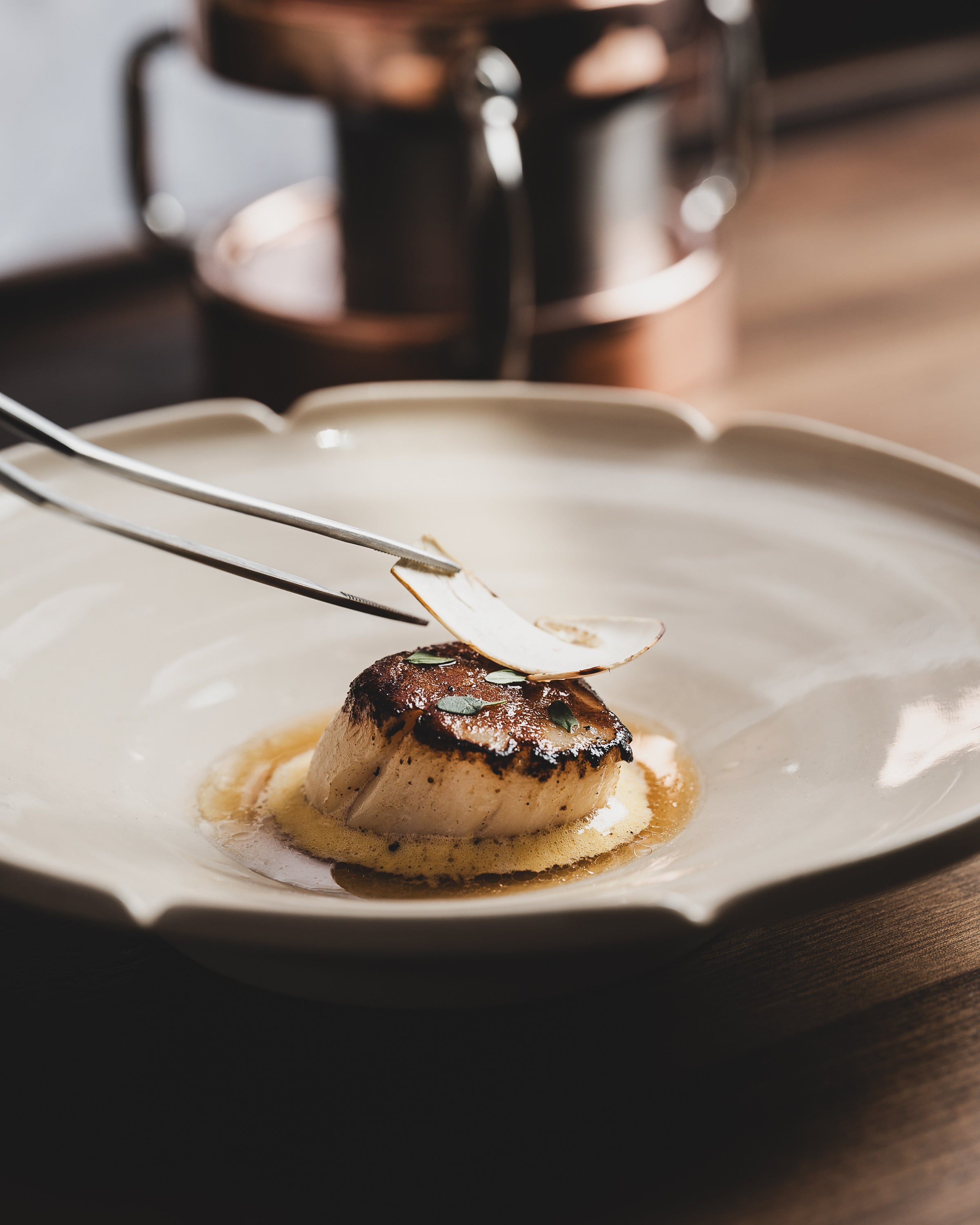 Scallop with miso sabayon, chicken dashi, roasted garlic and matsutake at Restaurant Zen. Photo: Franzten Group