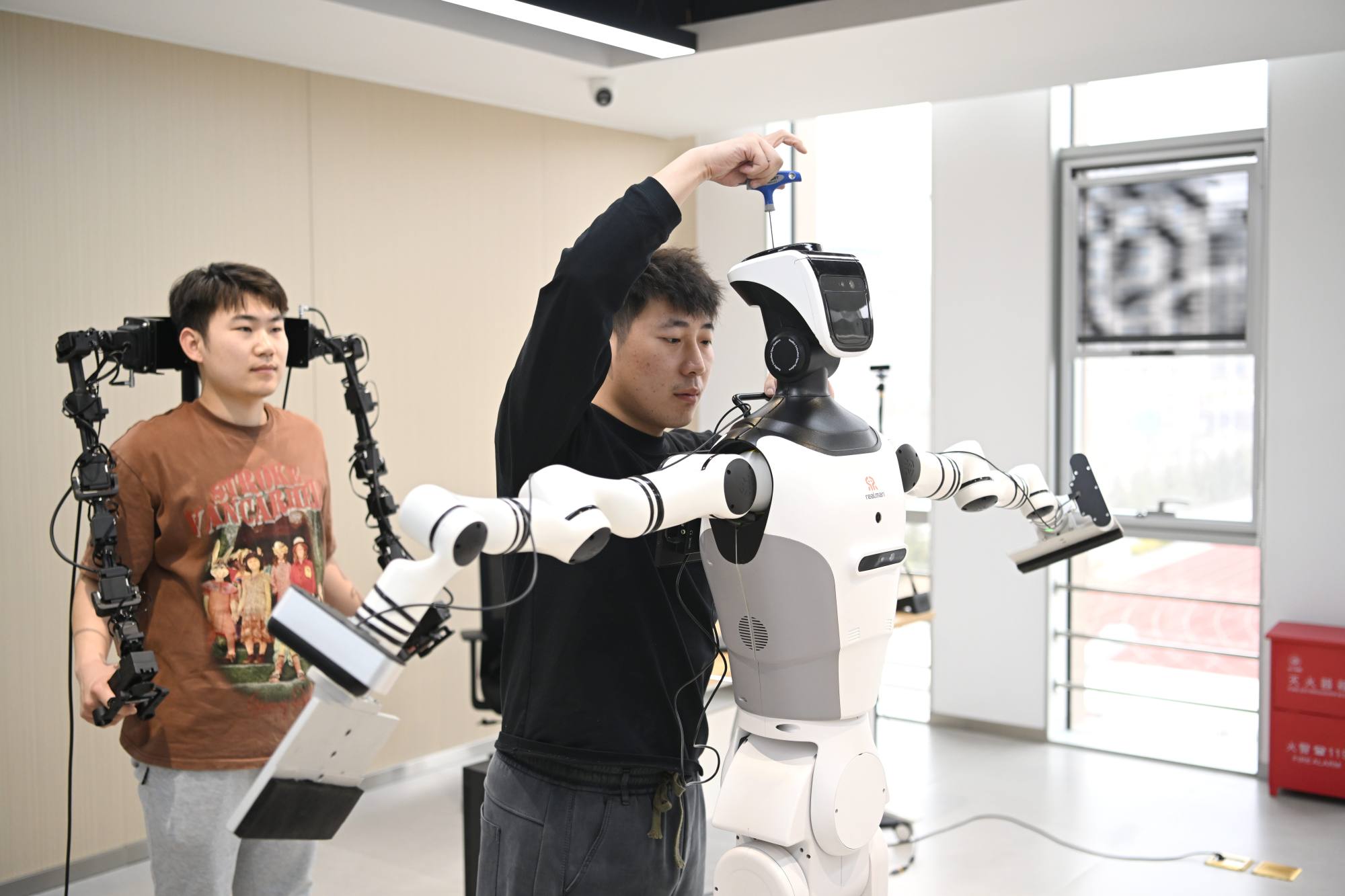 The photo above shows staff members debugging a robot at an embodied AI training facility operated by a digital urban technology subsidiary of China Xiong’an Group in the Xiong’an New Area, a major national development zone in north China’s Hebei province. Photo: Xinhua/Zhu Xudong The photo above shows staff members debugging a robot at an embodied AI training facility operated by a digital urban technology subsidiary of China Xiong’an Group in the Xiong’an New Area, a major national development zone in north China’s Hebei province. Photo: Xinhua/Zhu Xudong