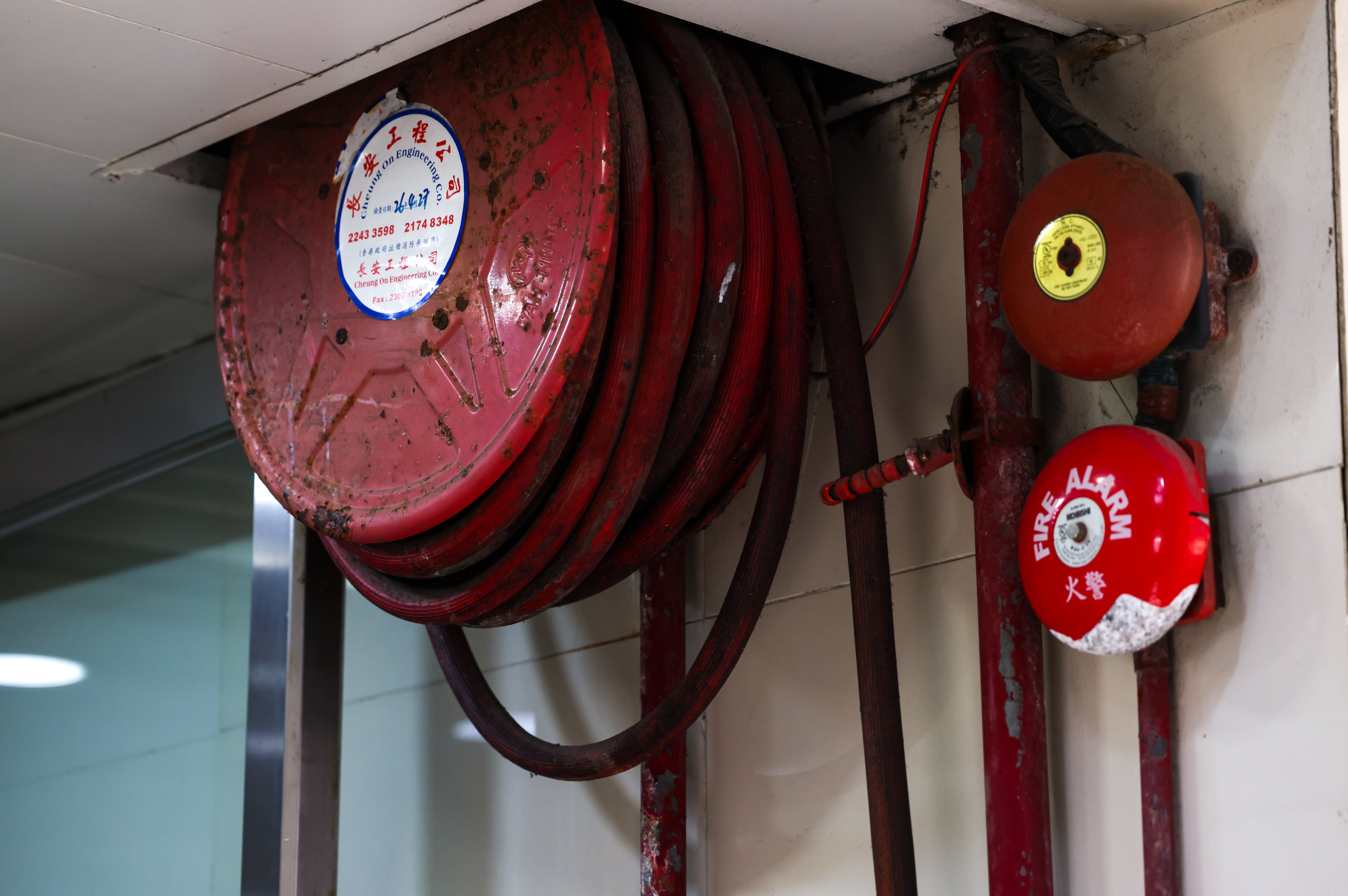 Traditional fire safety equipment includes fire alarms, hosepipe reels and sprinkler pipes. Photo: Silvia Siu