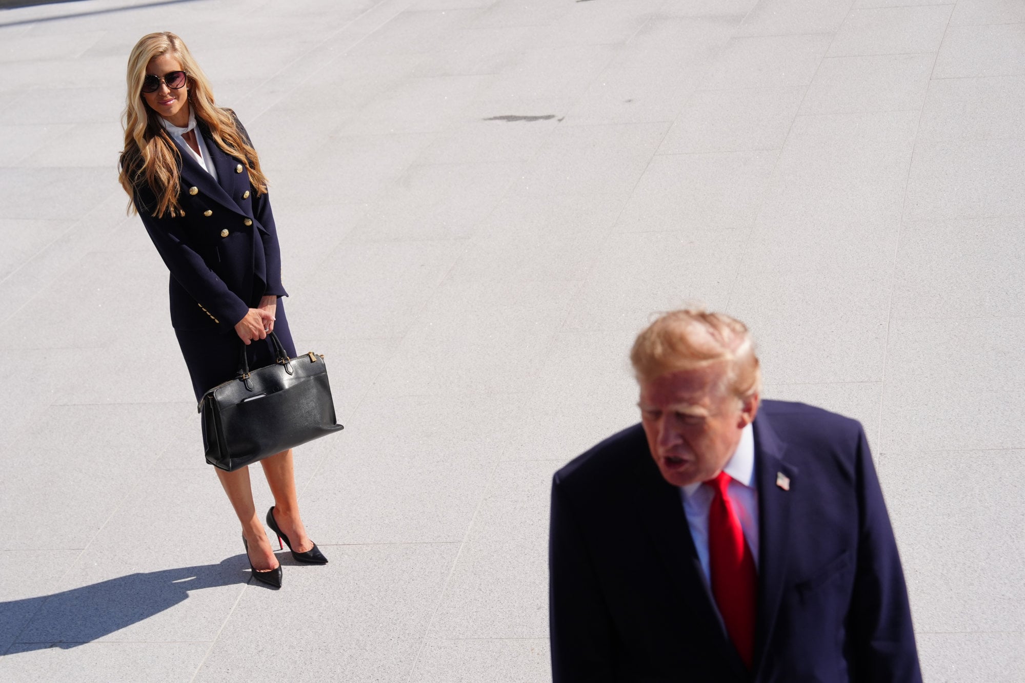US President Donald Trump speaks to reporters as White House press secretary Katie Zacharia looks on at the White House on Tuesday. Photo: AP US President Donald Trump speaks to reporters as White House press secretary Katie Zacharia looks on at the White House on Tuesday. Photo: AP