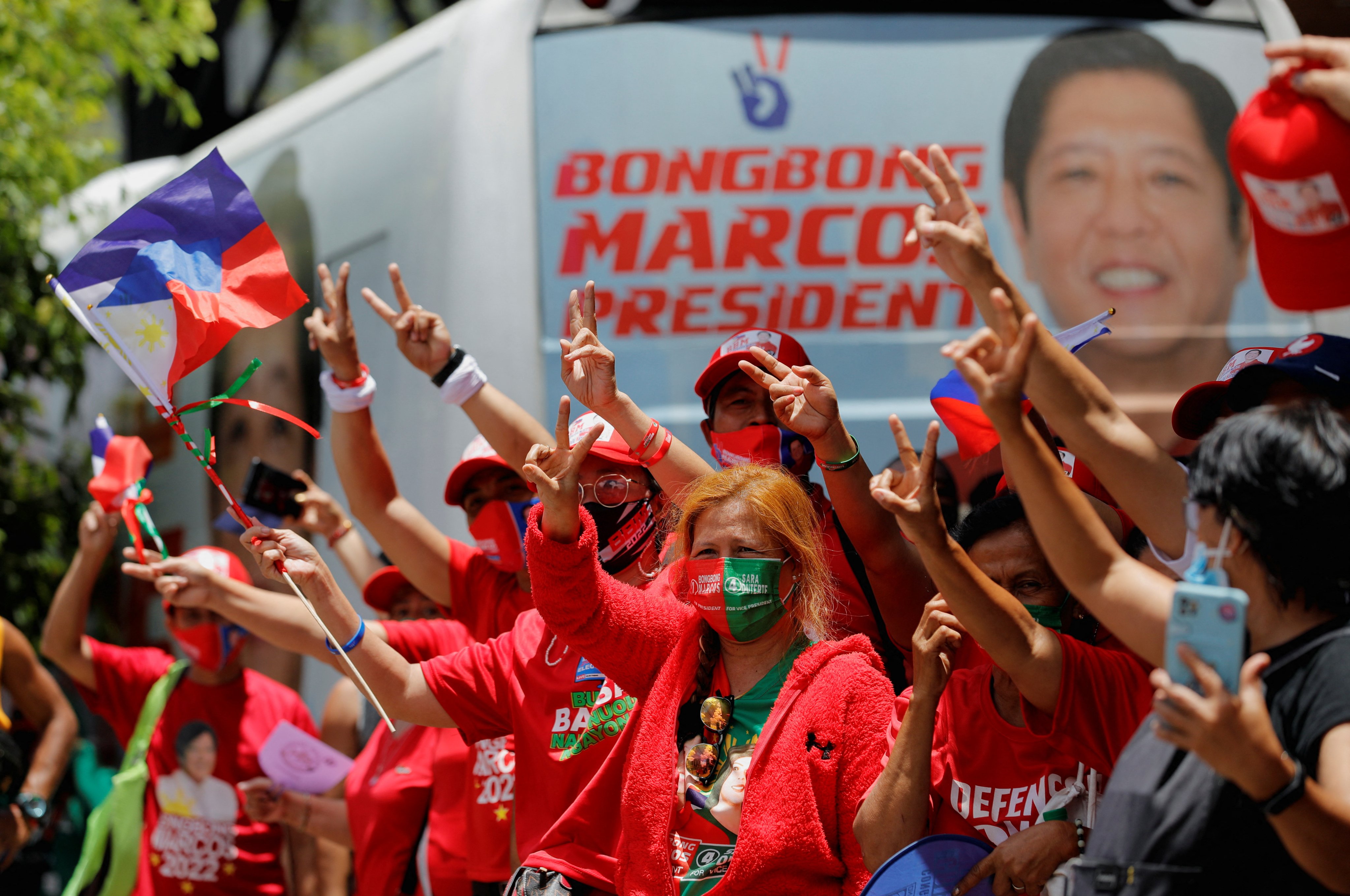 Supporters of then presidential candidate Ferdinand Marcos Jnr celebrate in Mandaluyong City, as partial results of the 2022 national elections show him with a wide lead over his rivals. Photo: Reuters