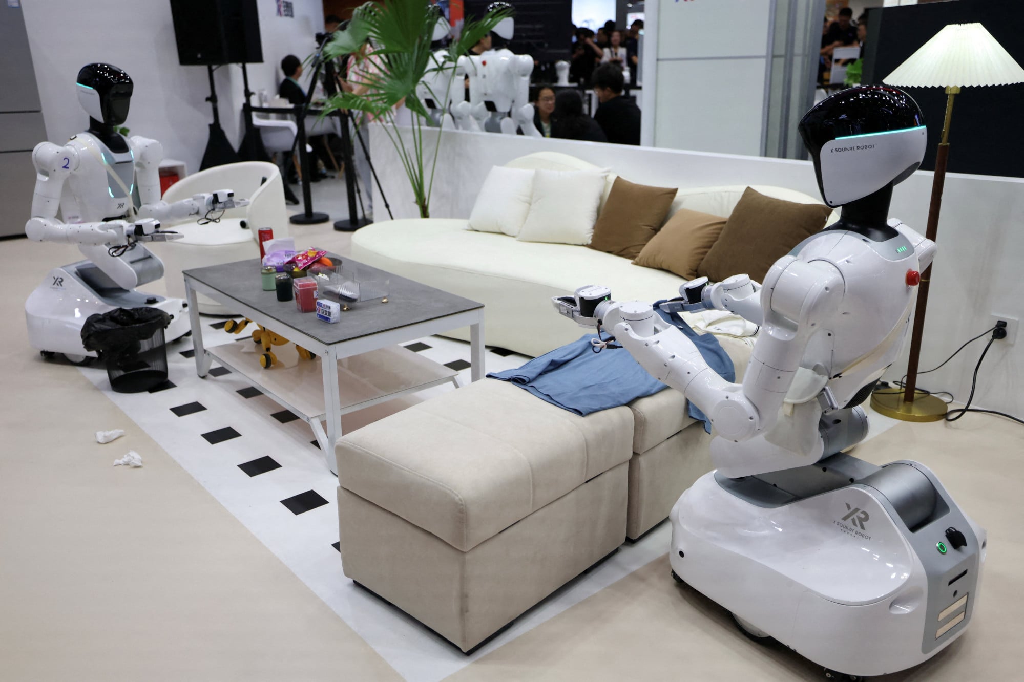 The photo above shows X Square humanoid robots demonstrating housework at a booth during the 2026 World Robot Conference in Beijing, China, on August 19, 2026. Photo: Reuters/Tingshu Wang The photo above shows X Square humanoid robots demonstrating housework at a booth during the 2026 World Robot Conference in Beijing, China, on August 19, 2026. Photo: Reuters/Tingshu Wang