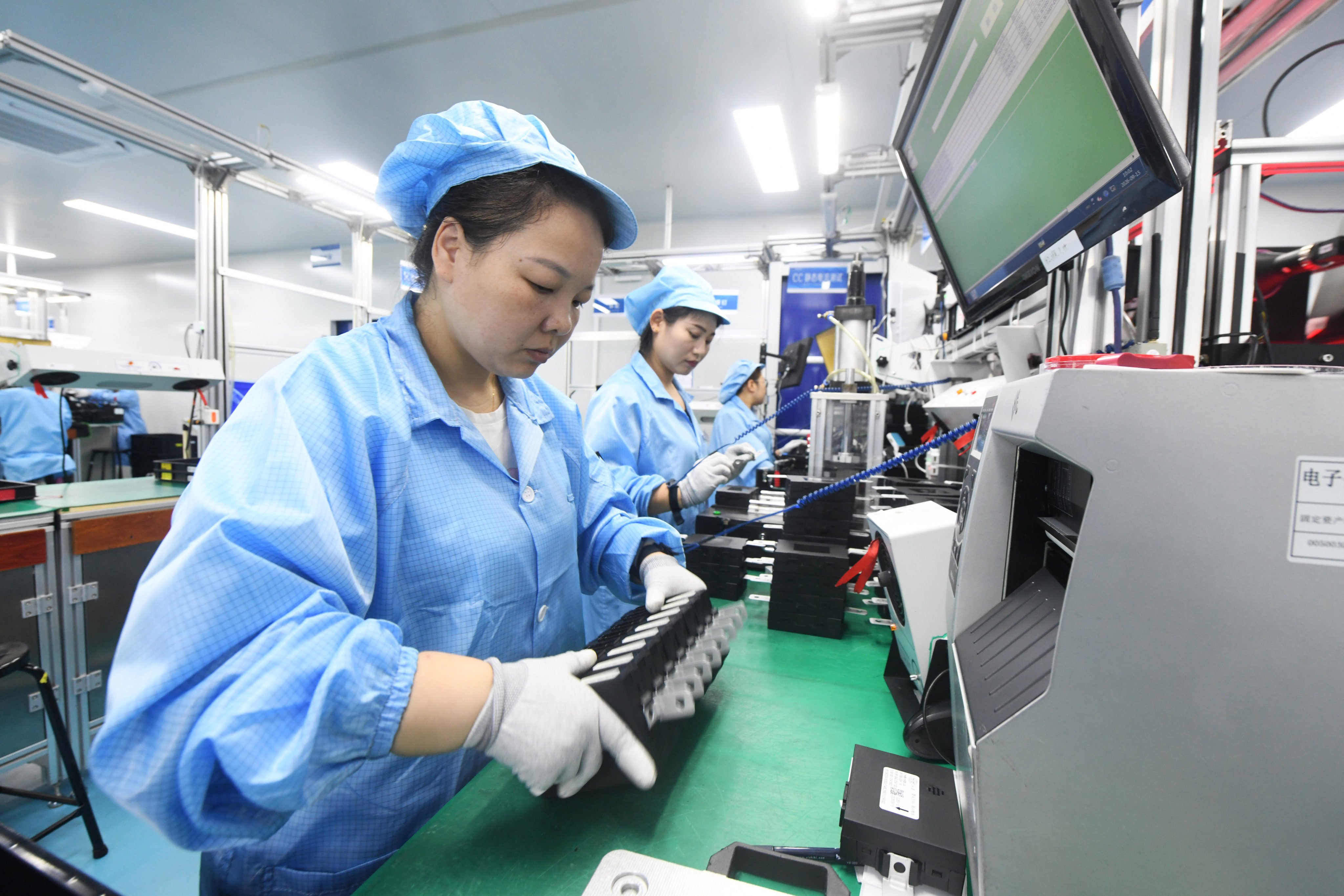 Workers prepare automotive electronics products for export at a factory in Shijiazhuang, Hebei province, last month. Photo: Xinhua