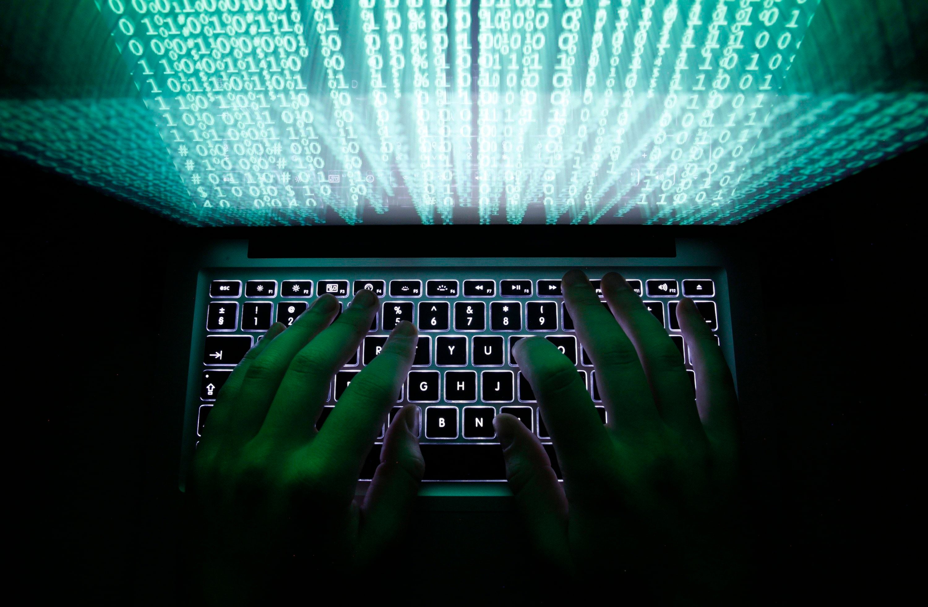 A man types on a computer keyboard. More than 500 breaches of Japanese corporate systems have been reported so far this year. Photo: Reuters