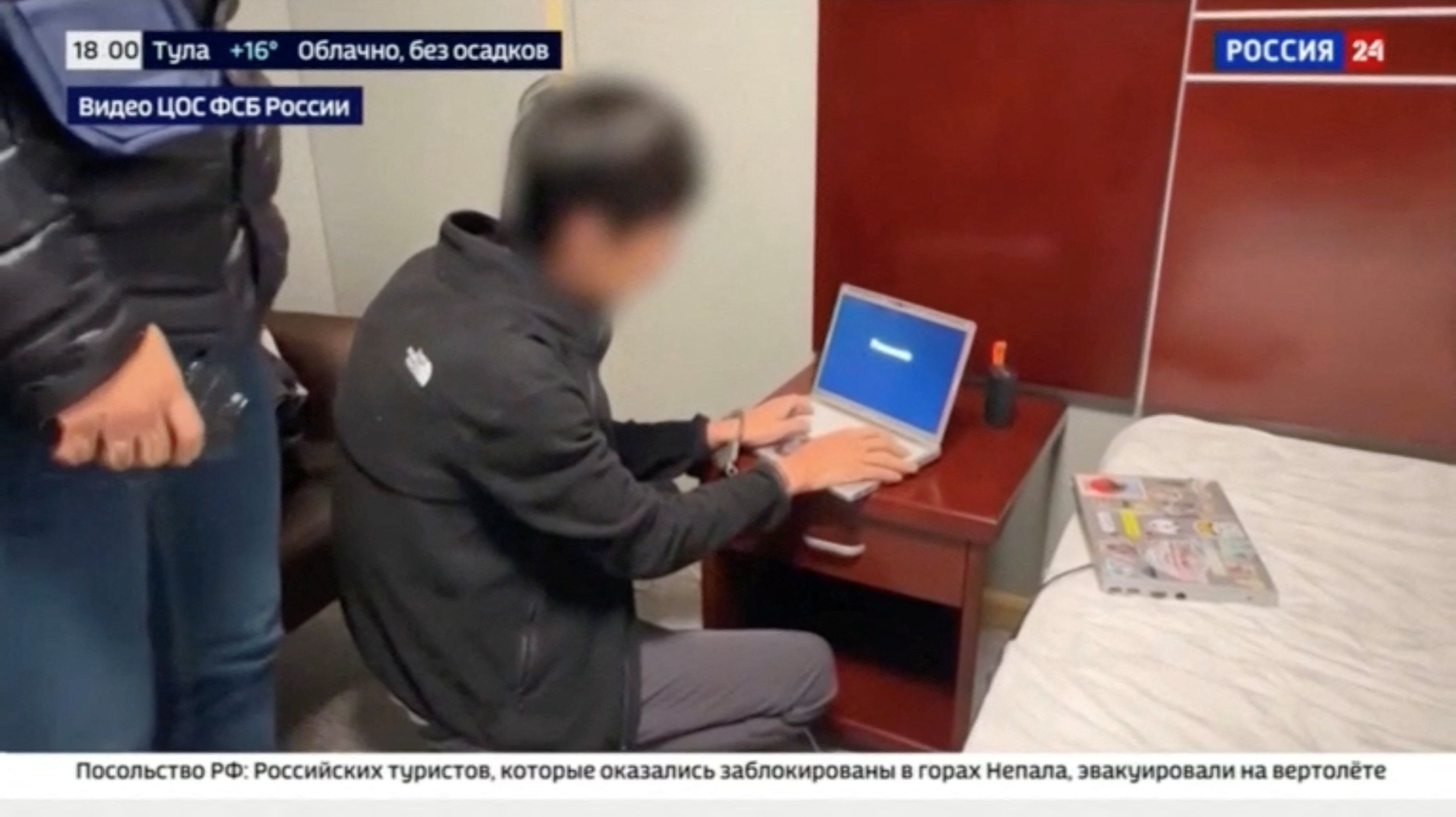 Russian state media footage shows the arrest of a person, identified by Russia’s Federal Security Service as a Japanese journalist for the Hokkaido Shimbun. Photo: Rossiya-24 via Reuters