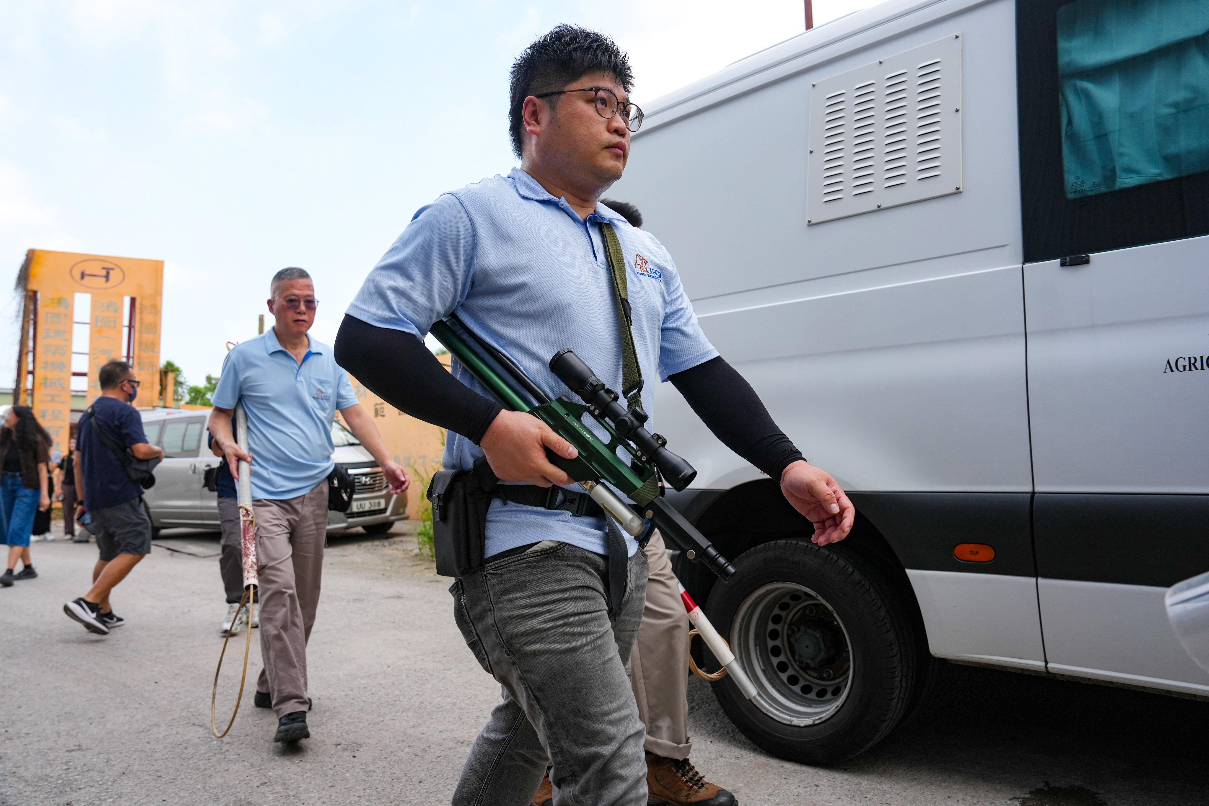 Police and the Agriculture, Fisheries and Conservation Department conduct a joint operation to search for stray or potentially dangerous dogs in Yuen Long. Photo: Kit Lai
