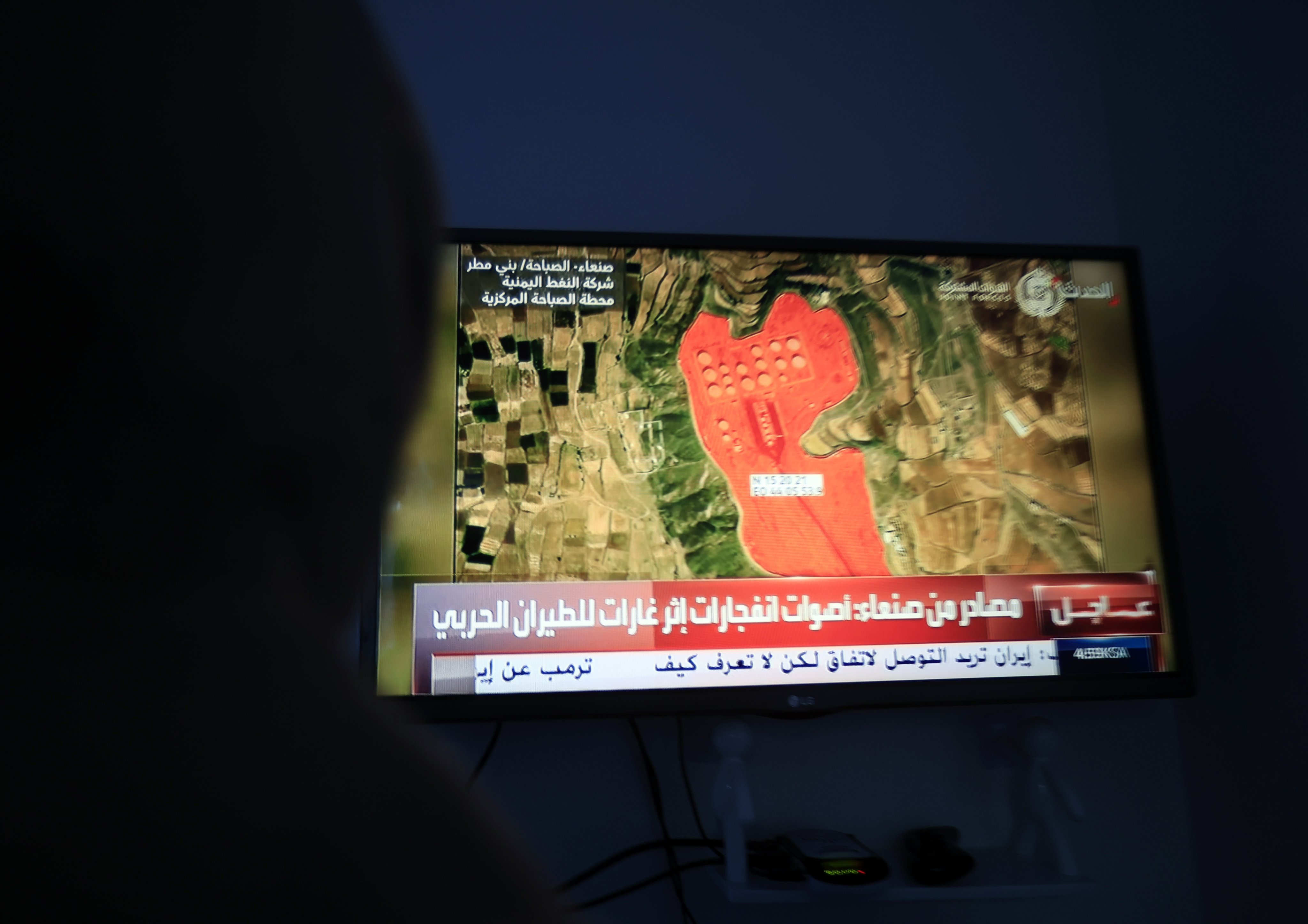 A television broadcast displaying an oil storage facility targeted by Saudi-led coalition strikes in Sanaa, Yemen. Photo: EPA