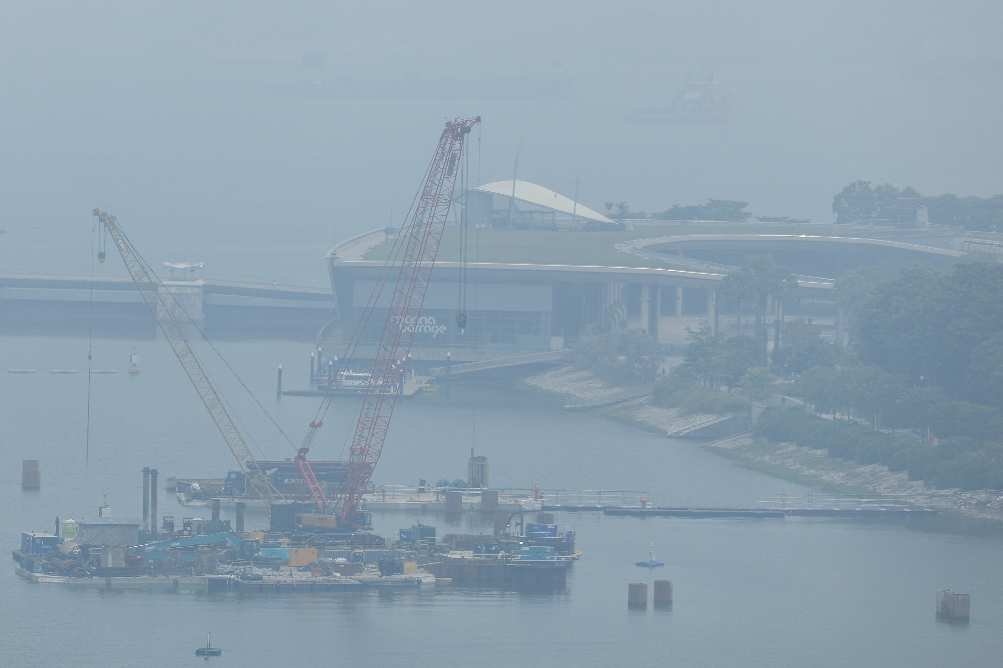 A thick haze shrouds the Marina Barrage area ahead of the 2026 Formula One Singapore Grand Prix in Singapore on Saturday. Photo: EPA