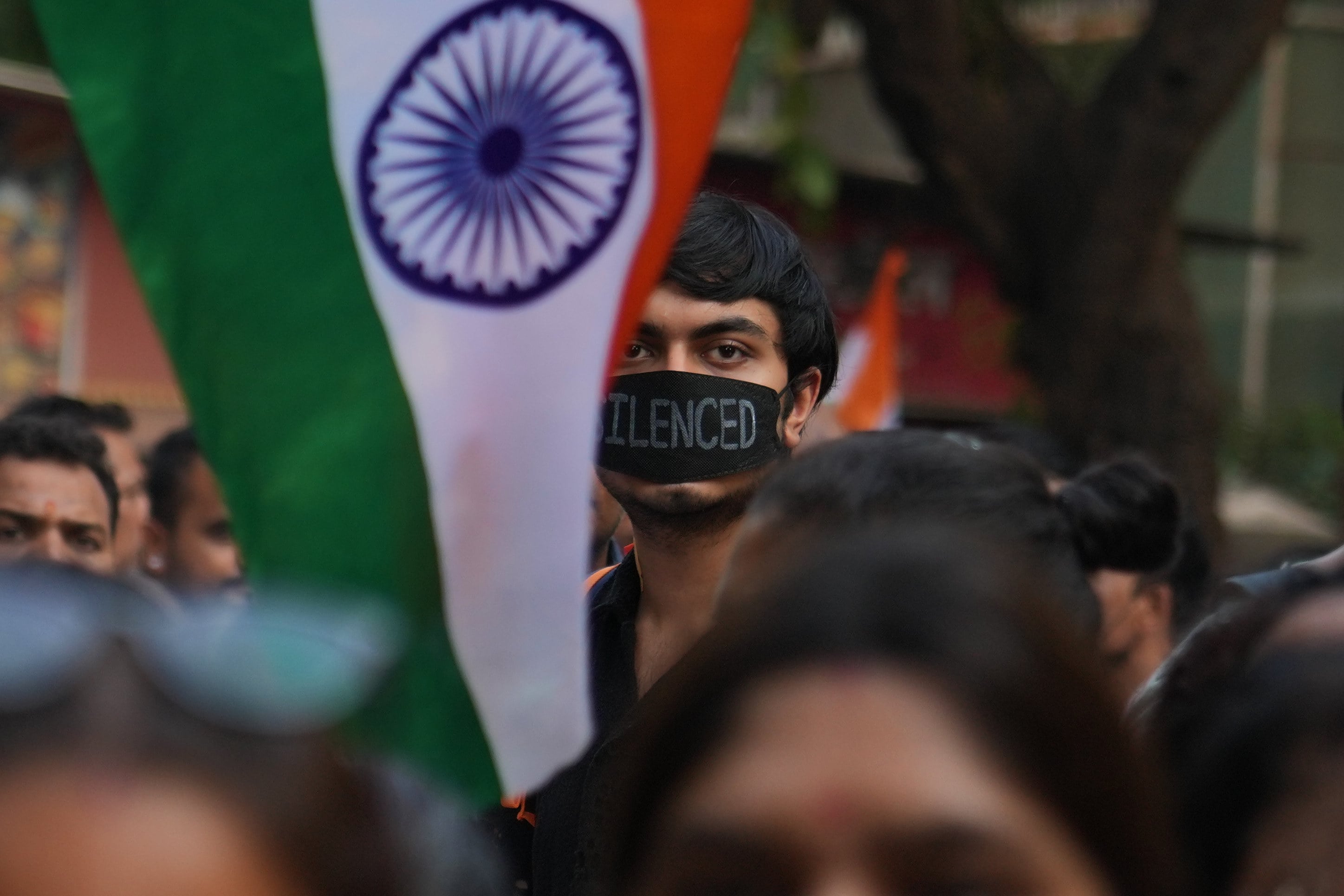 A protester wears a black cloth over his mouth during a demonstration demanding the resignation of India’s election chief in Mumbai on Monday. Photo: AP