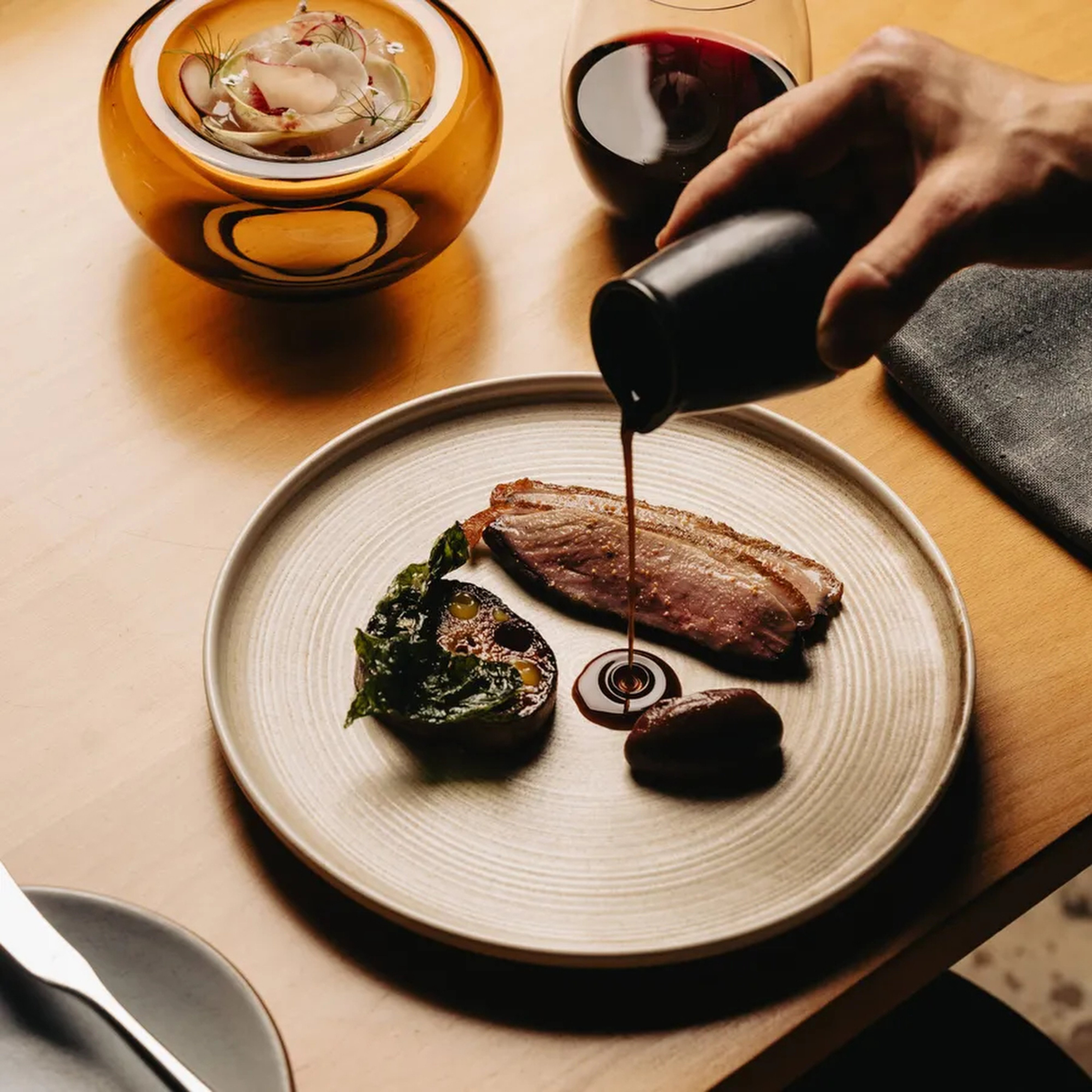 Dry-aged duck at Aurora at ILA in Adelaide. The restaurant is one of 11 restaurants awarded stars in the Michelin Guide South Australia 2027. Photo: Instagram/aurorarestaurantadelaide
