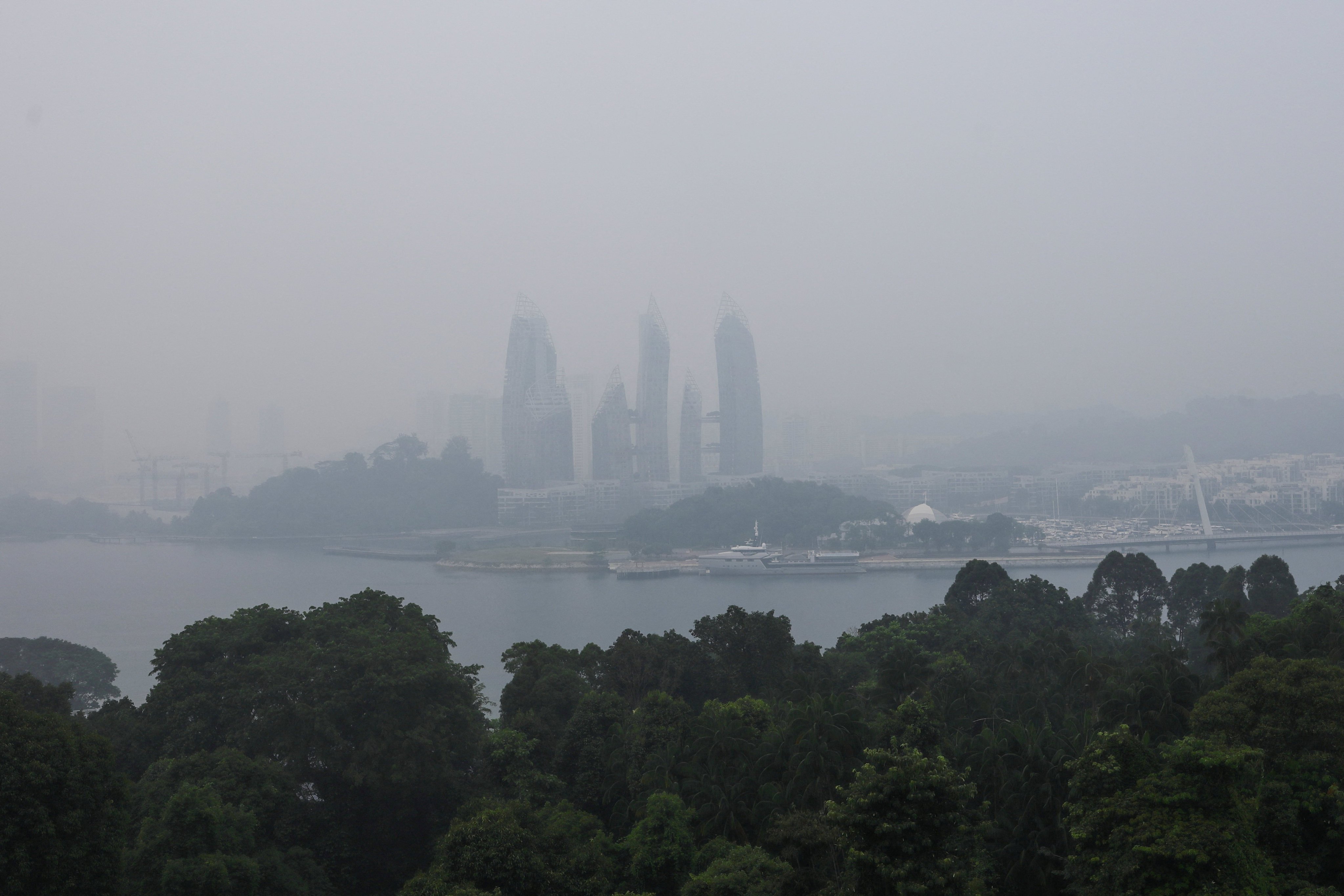 Haze shrouds a luxury condominium at Keppel Bay in Singapore on Wednesday. Photo: Reuters