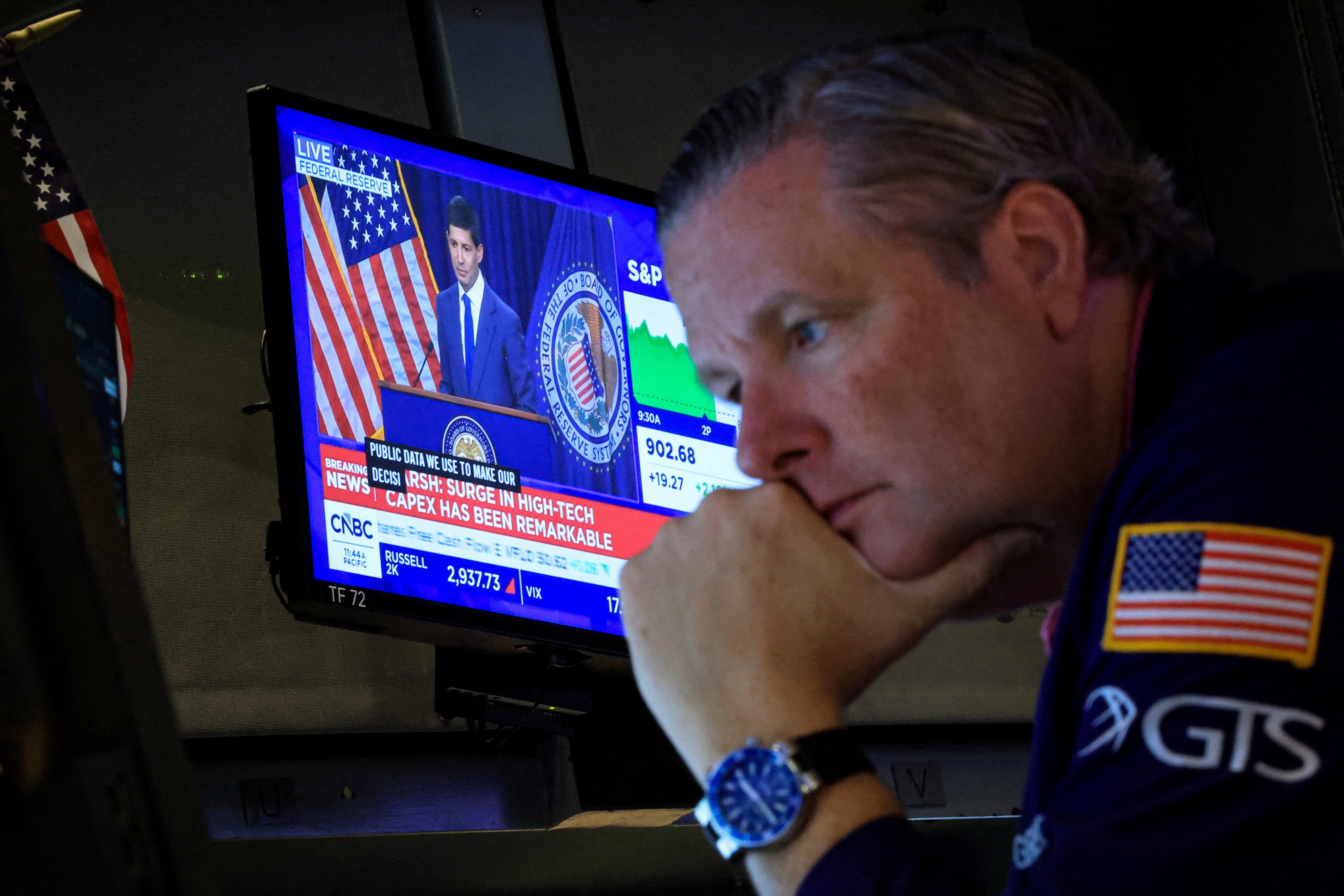 A trader works on the floor of the New York Stock Exchange in July. Photo: Reuters